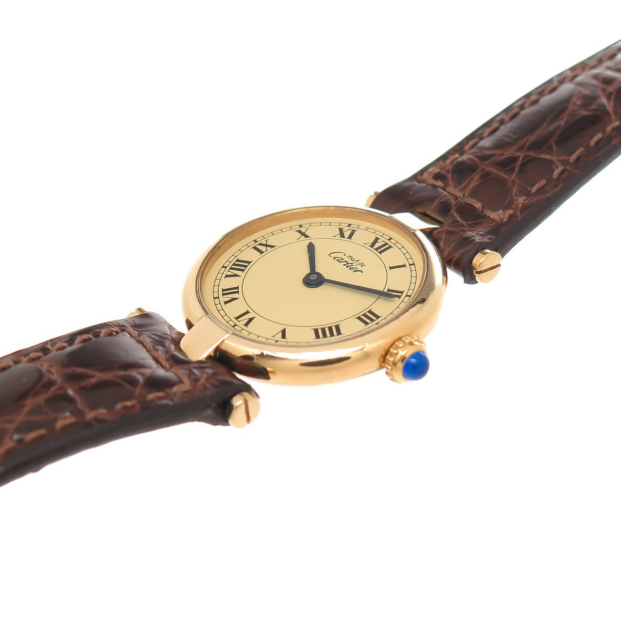 Circa 2000 Cartier, Must De Cartier Ronde Ladies Gold on Sterling Silver / Vermeil Wrist Watch. 24 MM Water Resistant case, Quartz Movement, Gold dial with Black Roman Numerals, Sapphire Crown. New Cartier Brown Croco Strap with Gold Plate Cartier