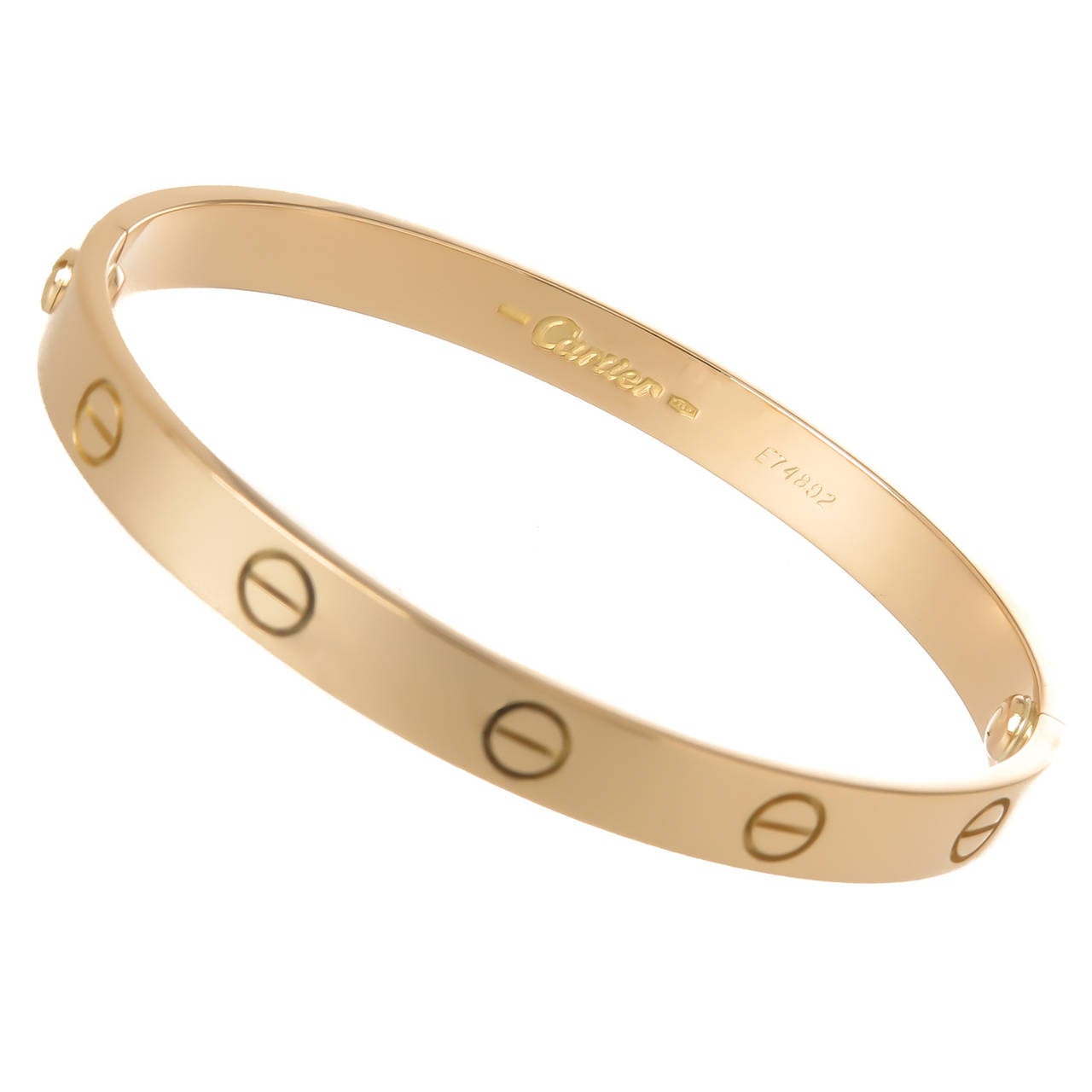 Circa 1998 Cartier 18K Yellow Gold Love Bracelet, size 17, signed, numbered and comes with original Love Bracelet Screw driver, felt pouch and original purchase Receipt.
