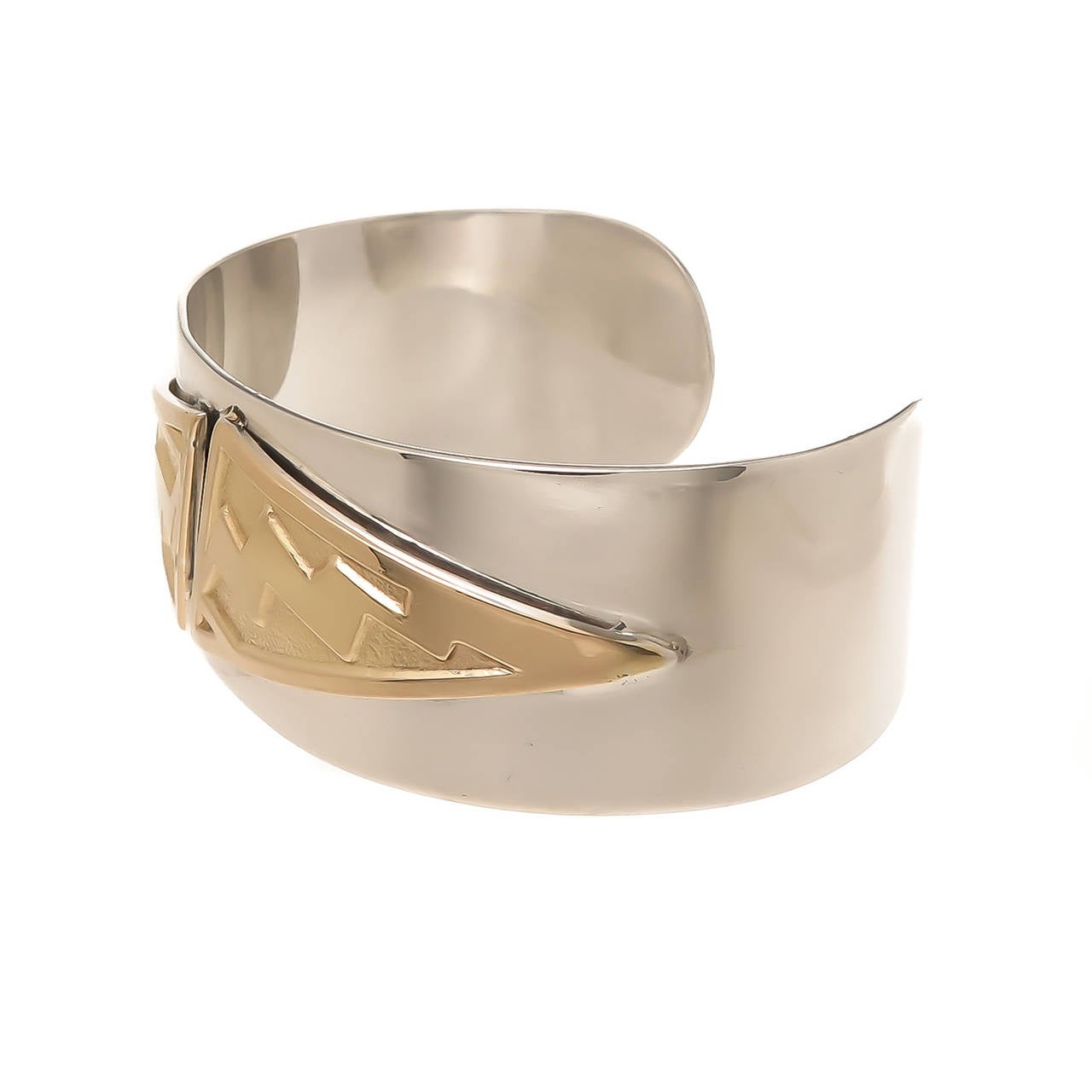 Circa 1970s ILias LaLaounis Sterling Silver and 18K Yellow Gold Cuff Bracelet, measuring 1 Inch wide and has a 1 1/8 inch wide opening and is pliable to bend and fit most any wrist.