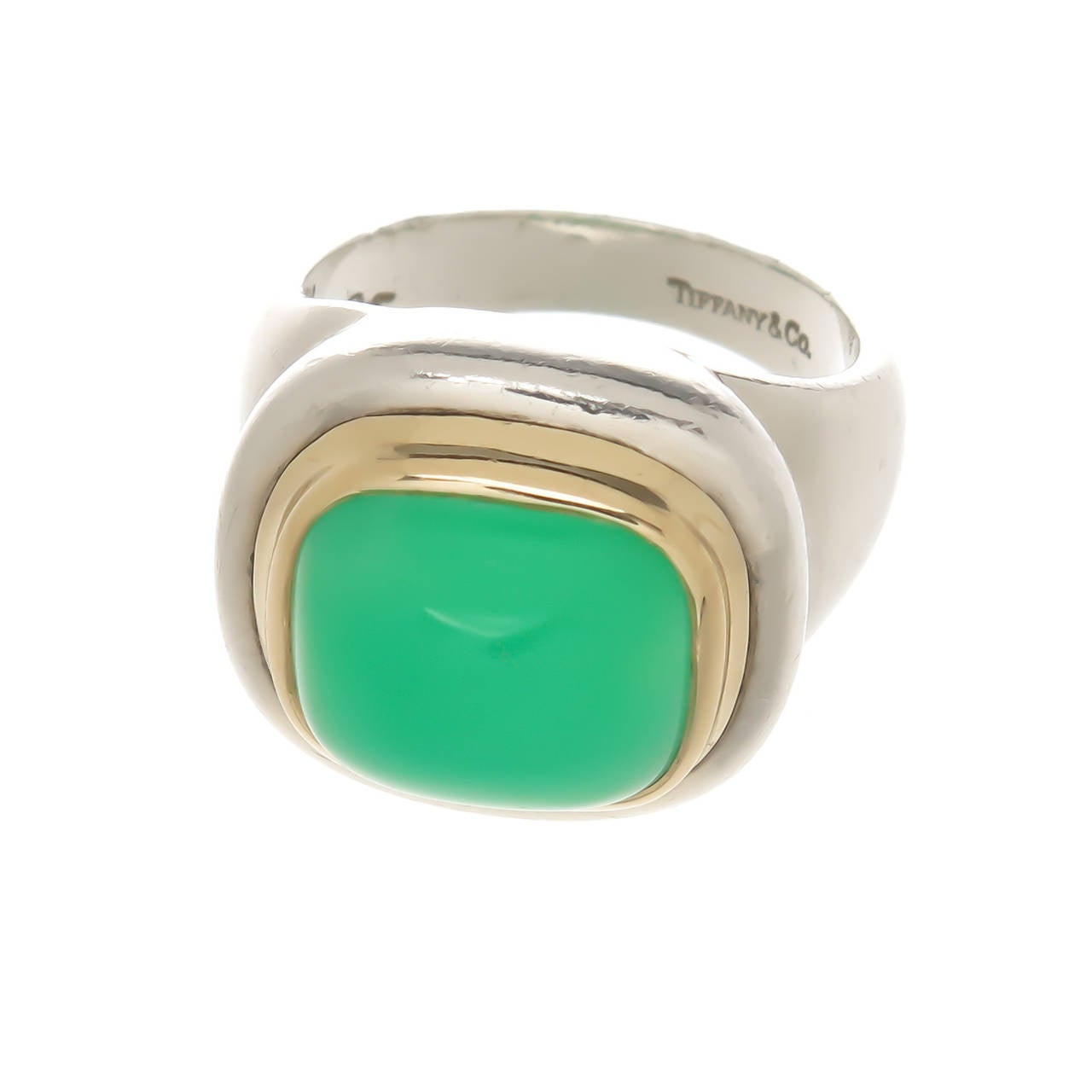 Circa 1980 Paloma Picasso for Tiffany & Company Sterling silver, 14K Yellow Gold ring set with a domed Green Chrysophrase . Top measuring 3/4 inch  X  5/8 inch. Finger size = 6