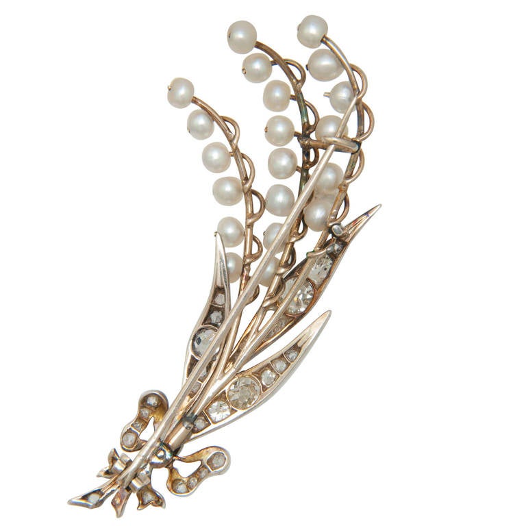 Circa 1900 Silver Topped and Gold Back Lilly of the Valley Brooch set with Mine cut Diamonds totaling 2 Carats and further set with 3 to 5 MM Natural Pearls.