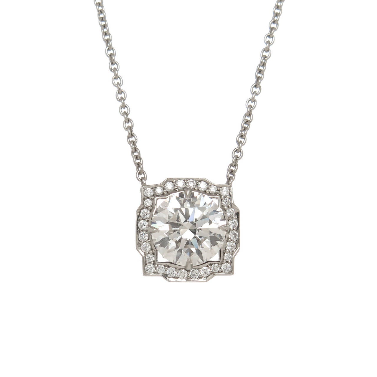 Circa 2013 Harry Winston Belle Collection Diamond Solitaire Platinum pendant necklace,  center stone weighing 1.52 Carat and GIA certified as F in Color and VS2 in Clarity, further surrounded by .13 carats round brilliant cuts. Suspended from a