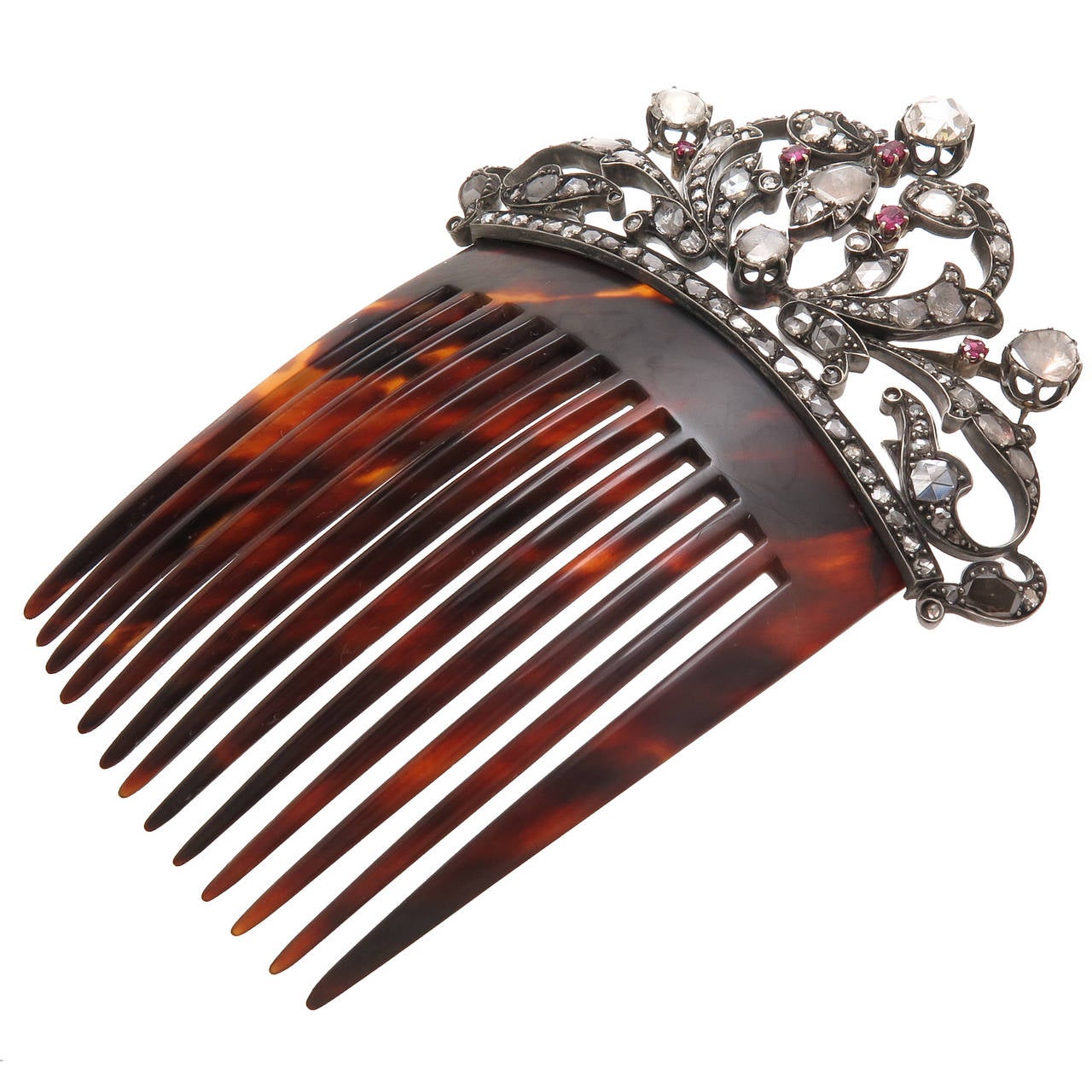 Circa 1900 Silver Top with Gold back and Tortoise Shell Hair Comb, set with approximately 5 carats of Rose cut Diamonds of varying sizes and further set with Rubies. The diamonds have a lot of life and give off a lot off sparkle. Larger than most