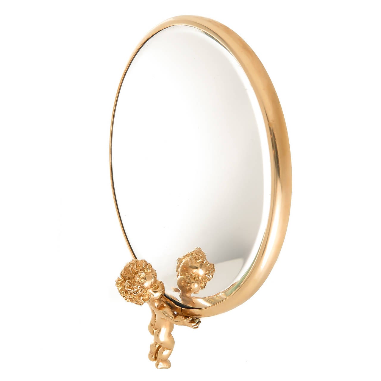 Circa 1960s Ruser 14K yellow Gold Evening Bag Mirror, 2 sided with a beveled Mirror and a very cute, figural and detailed baby, a Ruser trade mark looking at his own reflection in the mirror. Measuring 2 3/4 inch in diameter with the Baby figure