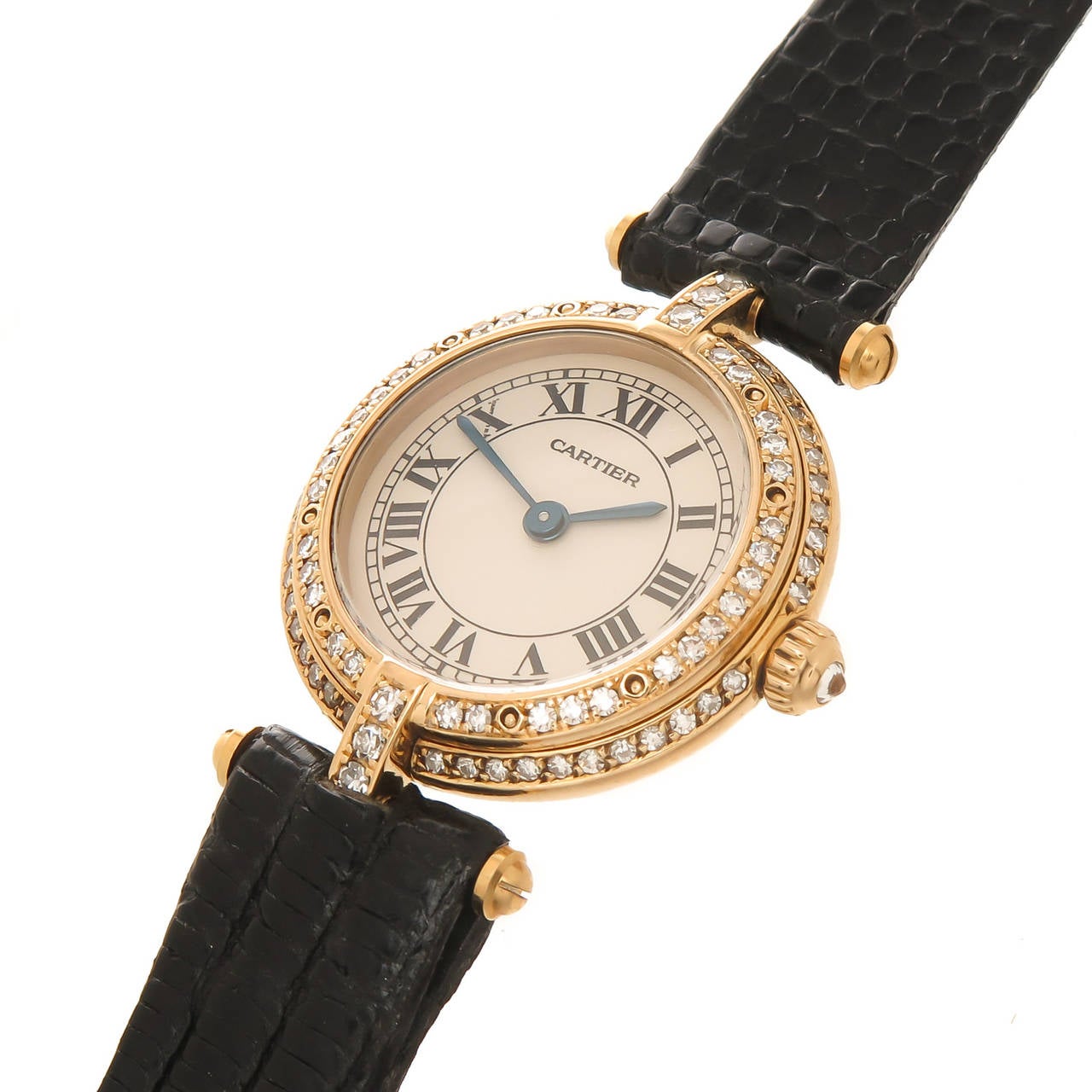 Circa 2000 Cartier Vendome ladies watch, 18K Yellow Gold with Factory set Diamond double row bezel totalling 1 carat. 24 MM water resistant case, quartz movement, white dial with Black Roman numerals and a Diamond set Crown. New Black Lizard strap.