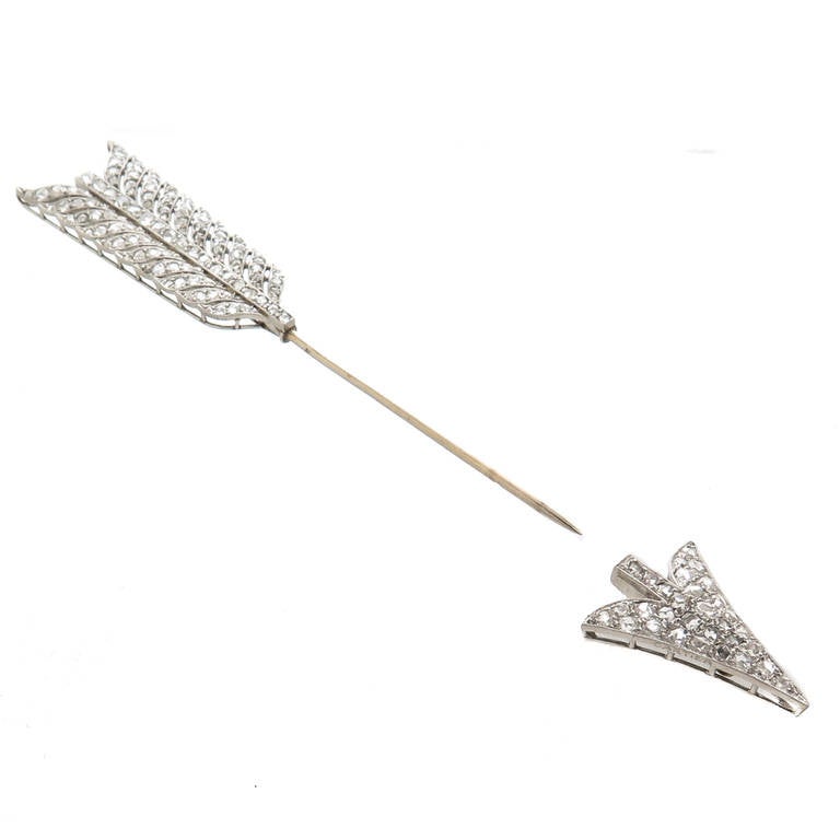 Edwardian, Platinum and Diamond Arrow Form Jabot Pin by Cartier Paris, measuring 3 3/4 inch in length and 5/8 inch wide. Set with approximately 3 Carats of Rose Cut Diamonds. Signed, Numbered and having several French Control Marks.