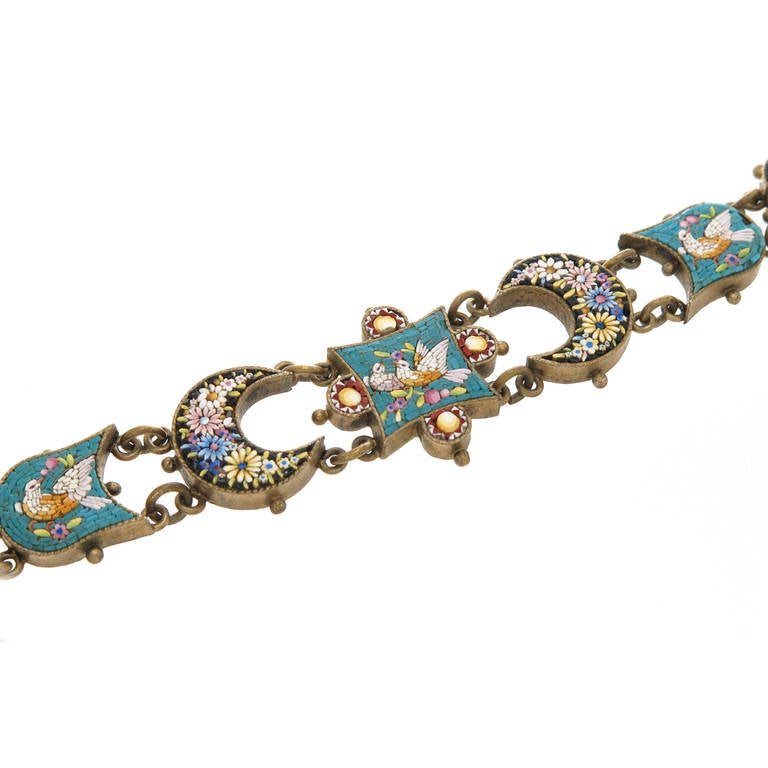 Circa 1920s Italian Micro Mosaic Bracelet set in Gilt Metal, Fine Detail with individual sections having birds and flowers. Length 7 1/8 inch.