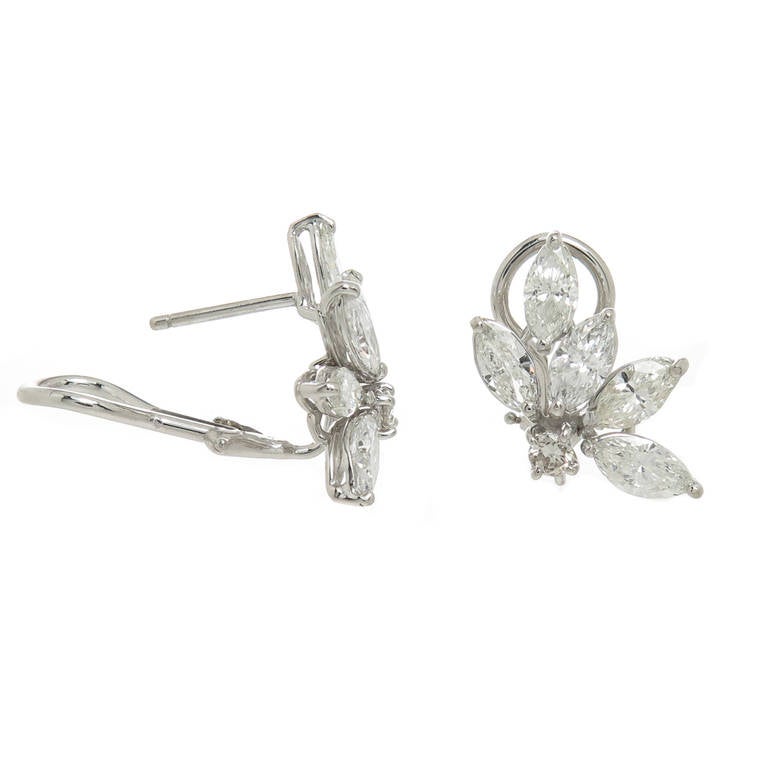 Circa 1960s 18K white Gold and Diamond Ear Clips, set with Marquise Diamonds totaling 3.30 carats and 2 Round Diamonds totaling .20 Carats, The Diamonds are graded as F to G in Color and VS in Clarity. Post Backs with Omega Clips. Measuring 3/4 inch