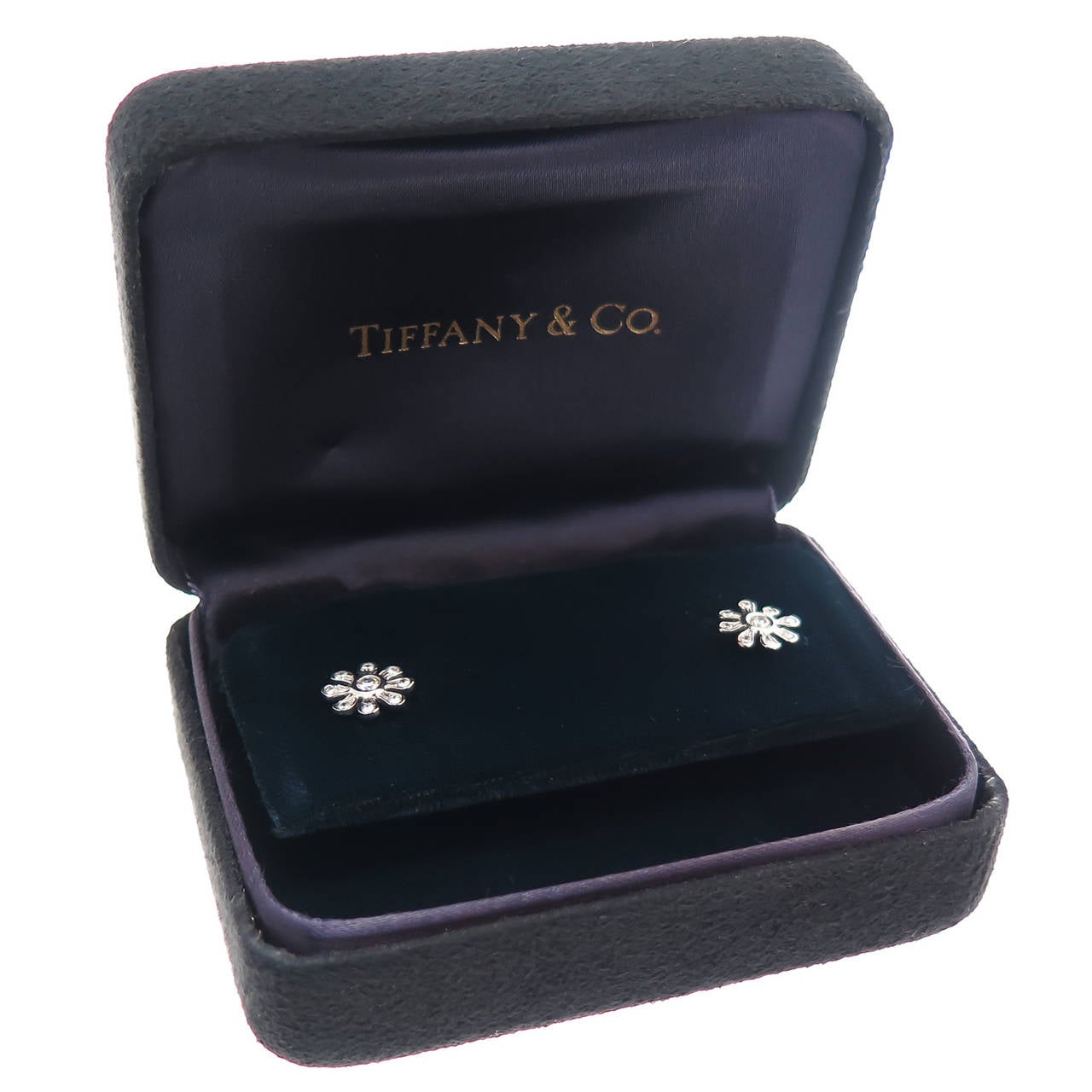 Circa 2005 Diamond and Platinum Earrings by Paloma Picasso for Tiffany and Company. Round Brilliant cut Diamonds totaling .30 Carats, measuring 3/8 inch in Diameter. Original Presentation Box.