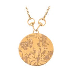 Gucci - Collier disque floral en or jaune