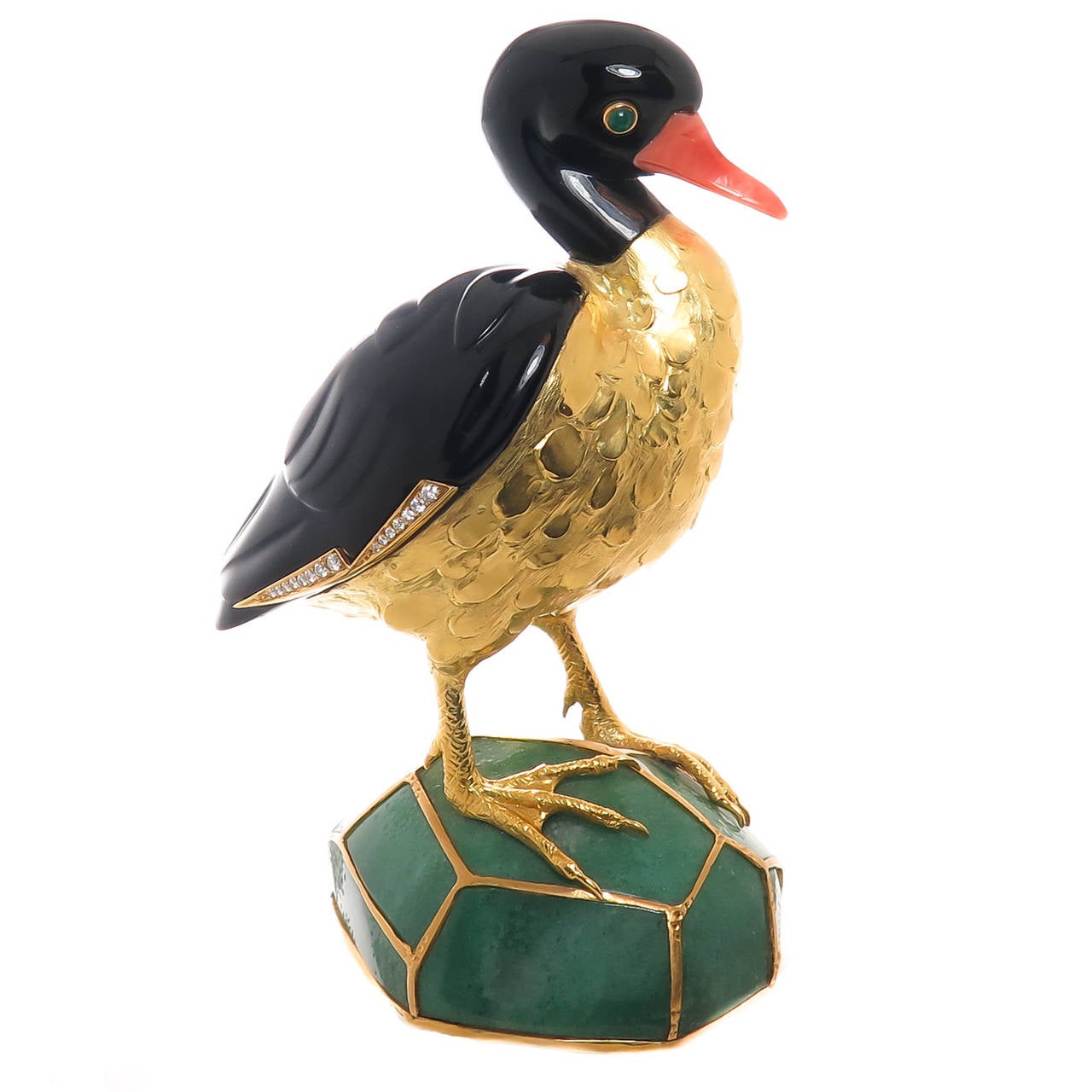 Circa 1980 Figural Duck by Erwin Klein for Vacheron & Constantin, standing 5 3/4 inch in height, hand chased 18K Yellow Gold body and feet, with  Black Onyx Feathers and Head, Coral Beak, Gold bezel set Cabochon Emerald Eyes, Round brilliant cut