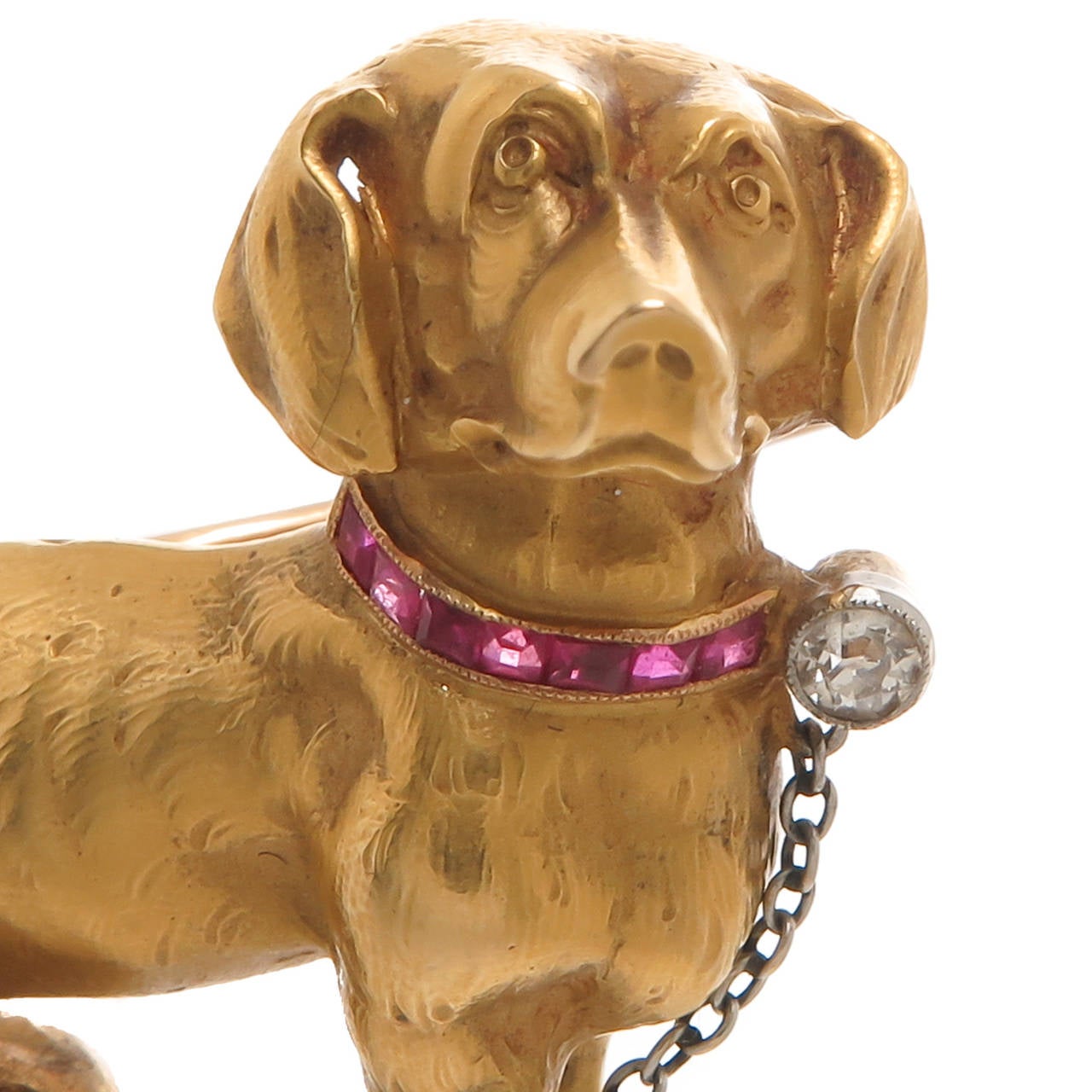 Circa 1950 18K Yellow Gold Dachshund dog brooch, Ruby and Diamond set Collar and a white Gold Leash. Very nicely detailed. Measuring 1 1/4 Inch in length.