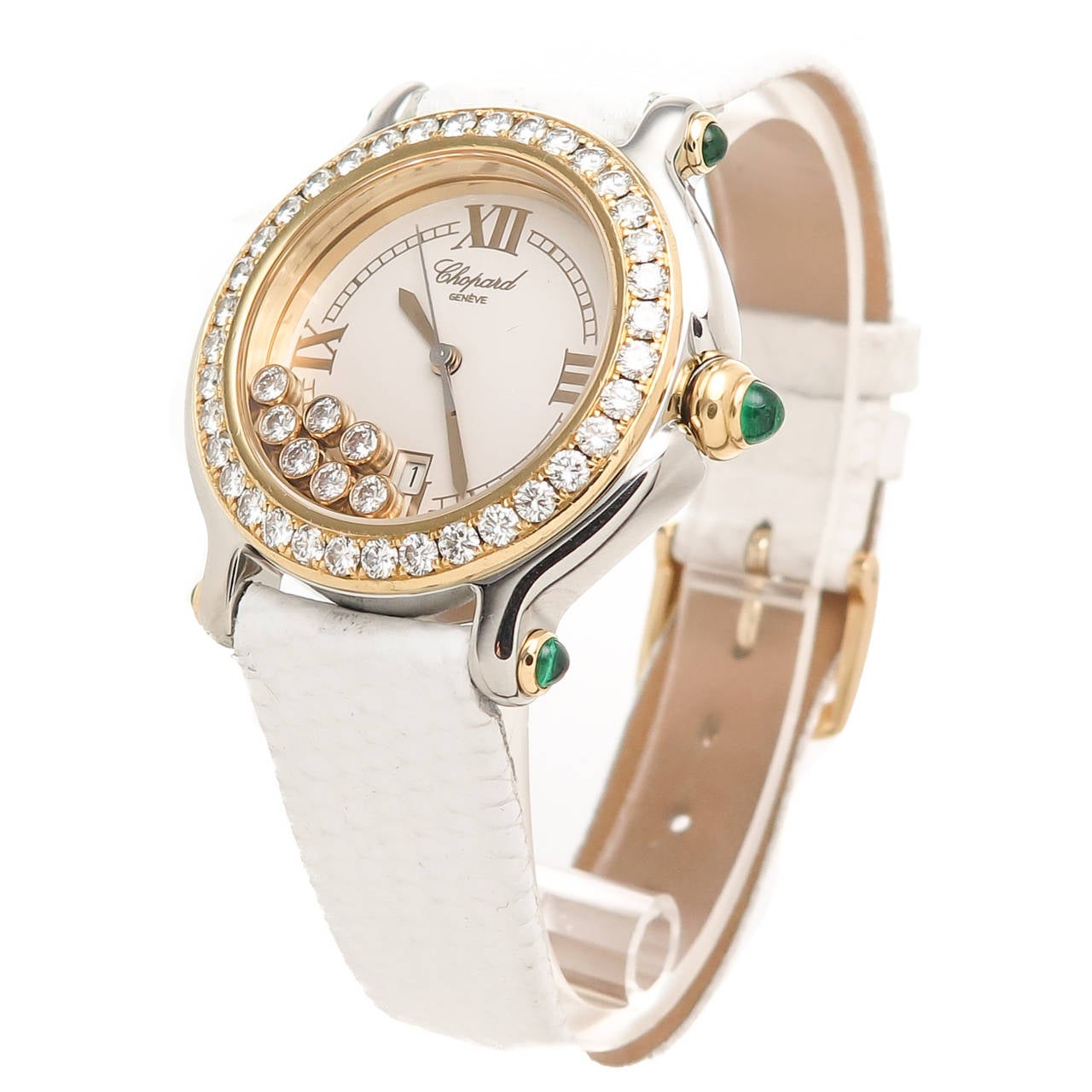 Chopard Lady's stainless steel and Yellow Gold Happy Sport Wristwatch, 7 Floating Diamond, Diamond Bezel. Measuring 32 mm Yellow Gold Bezel set with 36 Round Brilliant-Cut Diamonds Totaling 1.80 Carats. Further Set with Cabochon Emeralds in the Lug