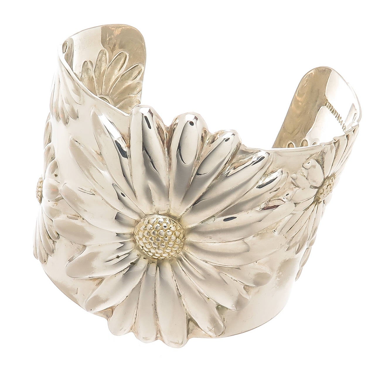 Tiffany & Company sterling silver with Gold Wash Accents Daisy Cuff Bracelet. Measuring 2 inch wide.