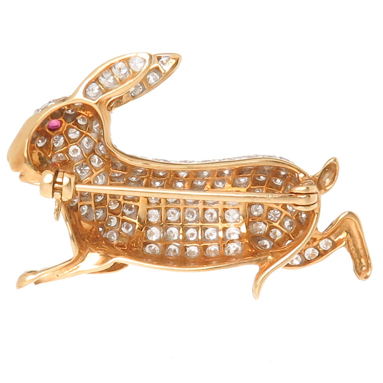 18K Yellow Gold Bunny Rabbit Brooch, set with Round Brilliant cut Diamonds totaling 2.50 Carats.Further accented with a Ruby Eye. Very Well made and nicely Detailed. Measuring 1 3/8 inch in length.
