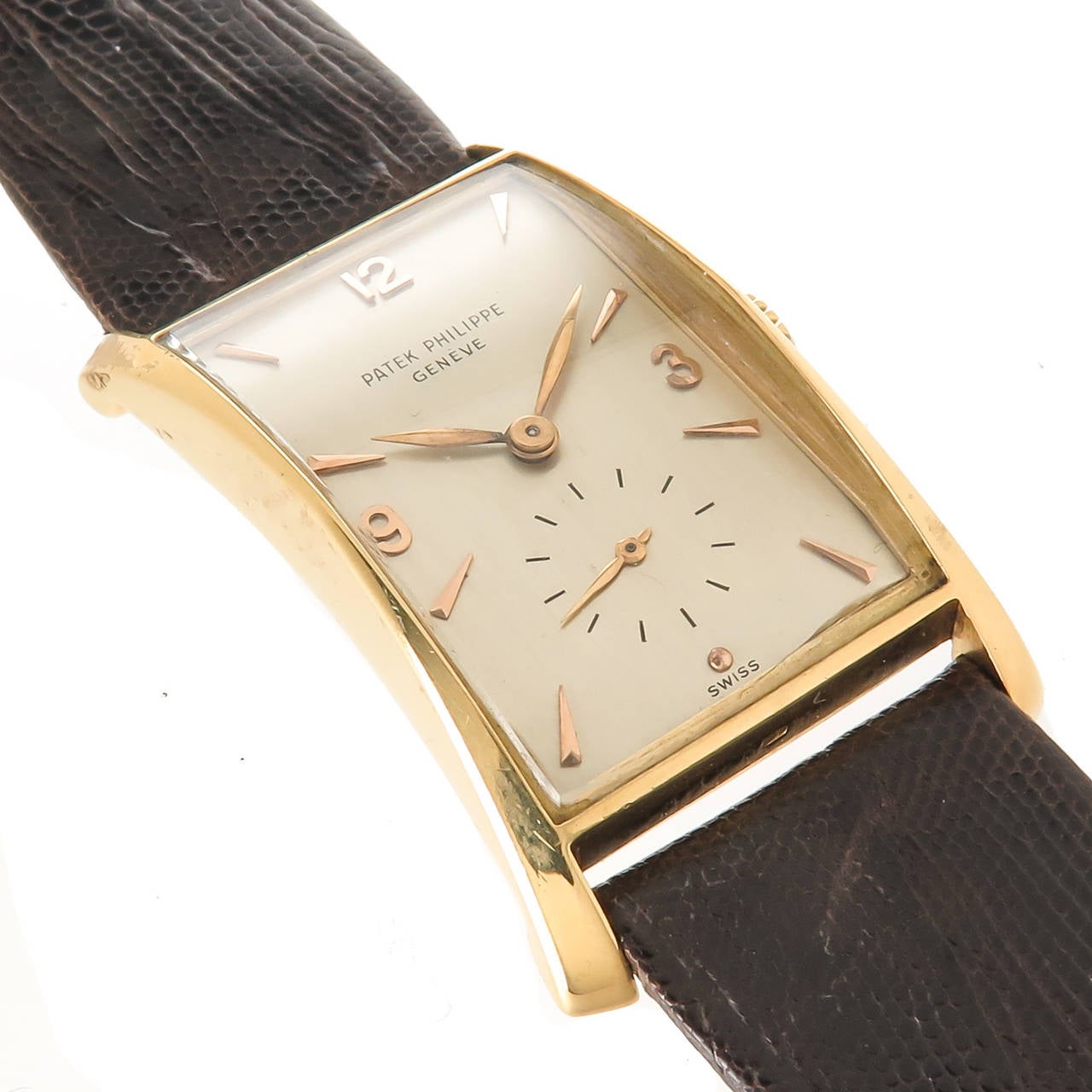 Circa 1950 Patek Philippe Reference 1593 Hour Glass Wrist Watch. Case measuring 41 X 22 M.M. 18 jewel manual wind  Caliber 9-90 Movement. Original Silvered Dial with raised gold Markers. Hirsch Lizard strap. Case and movement having correct Patek