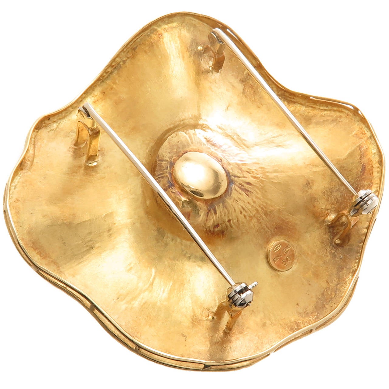Circa 1990 18K Yellow Gold Brooch by Seiden Gang, in a Petaled flower design this is wonderfully hand textured, centrally set with a Pearl measuring 13.5 M.M.   Measuring 2 1/2 Inch in Diameter.