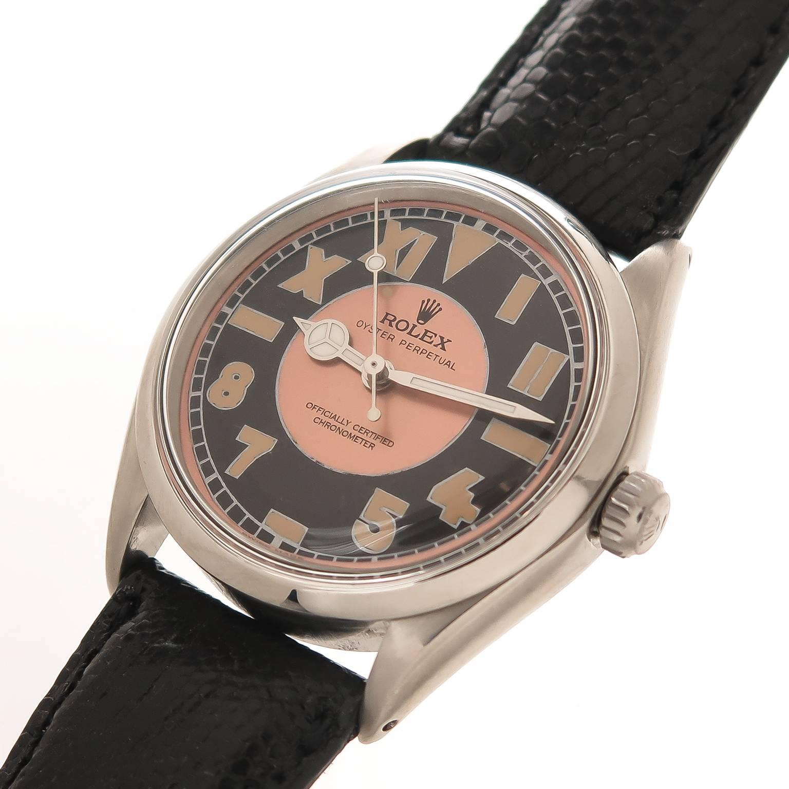 Circa 1974 Rolex Reference 5500, 34 MM water proof 2 piece case. Caliber 1520 Automatic, self winding movement. Custom Black and Rose California style dial with half Roman and half Arabic numerals with Luminous, Mercedes Hands and a center sweep