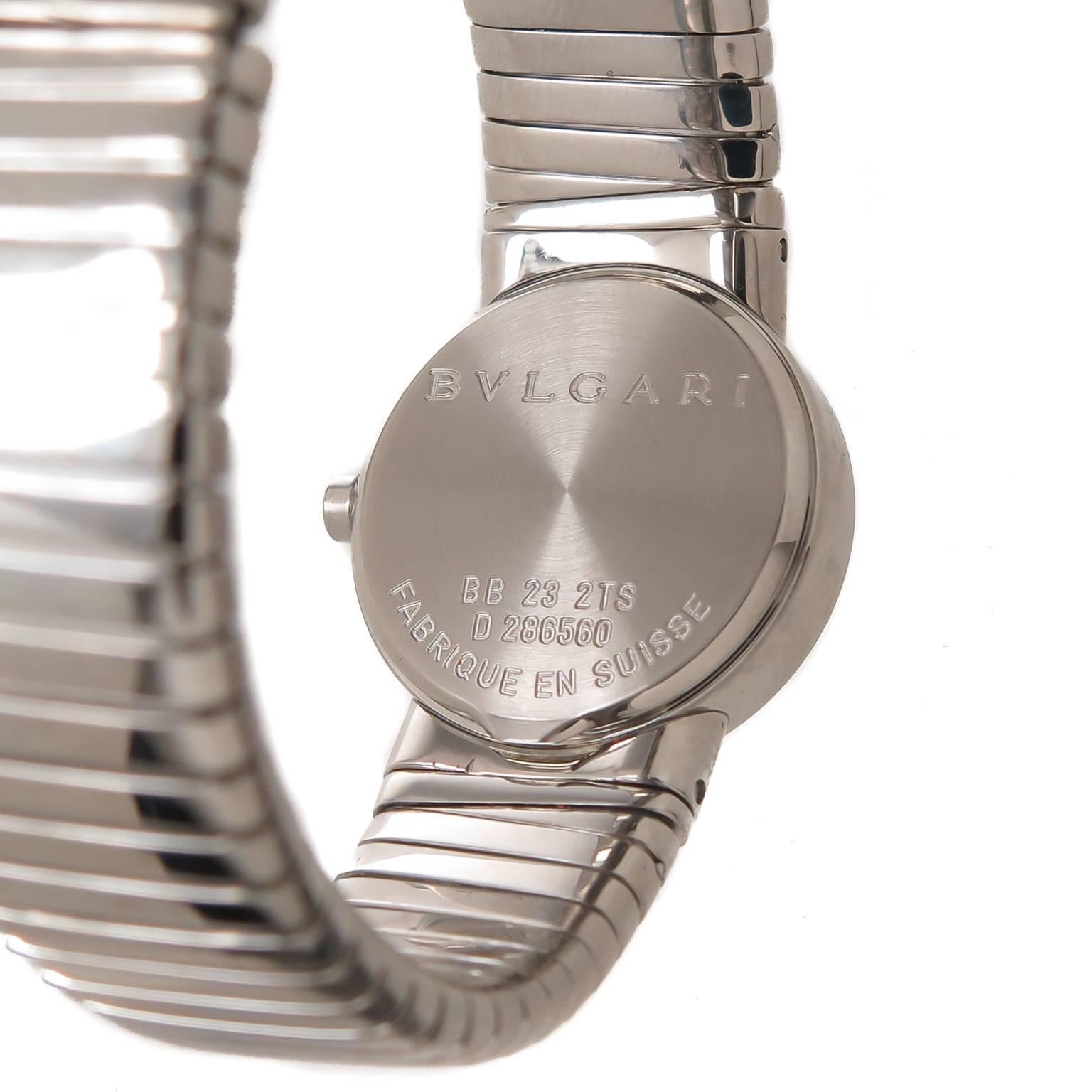 Circa 2005 Bulgari, Tubogas Collection, Ladies Stainless Steel Watch, 23 MM water resistant case, 9/16 inch wide bracelet that is flexible-adjustable and will fit a wrist from 5 1/2 to 8 inch. Quartz movement, Black dial with silver markers.