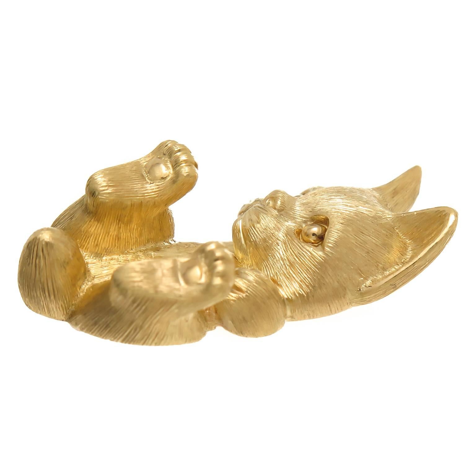 Circa 2000 18K yellow Gold Pussy Cat Brooch by Henry Dunay, measuring 1 3/8  X  3/4 inch, having nice weight being very nicely detailed and having a brushed finish. Signed and Numbered.