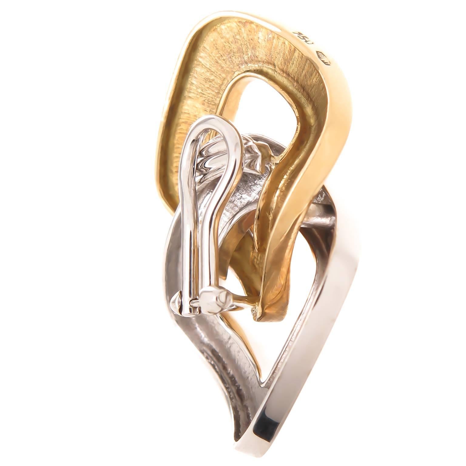 Circa 2012 Pomellato 18K White and Yellow Gold interlocking Cushion link Ear Clips. Measuring 1 1/2 inch in length and 1 inch wide. Having an Omega Clip back to which a post can be easily added if desired. 