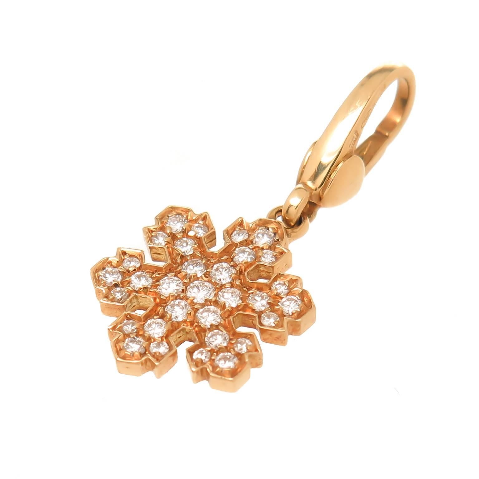 Circa 2012 Bvlgari Bvlgari collection 18K Yellow gold bracelet with detachable 18K Yellow Gold and Diamond Snowflake Charm., the bracelet measures 7 1/2 inch in length and is 1/4 inch wide. The charm measures just over 1/2 inch in diameter and is