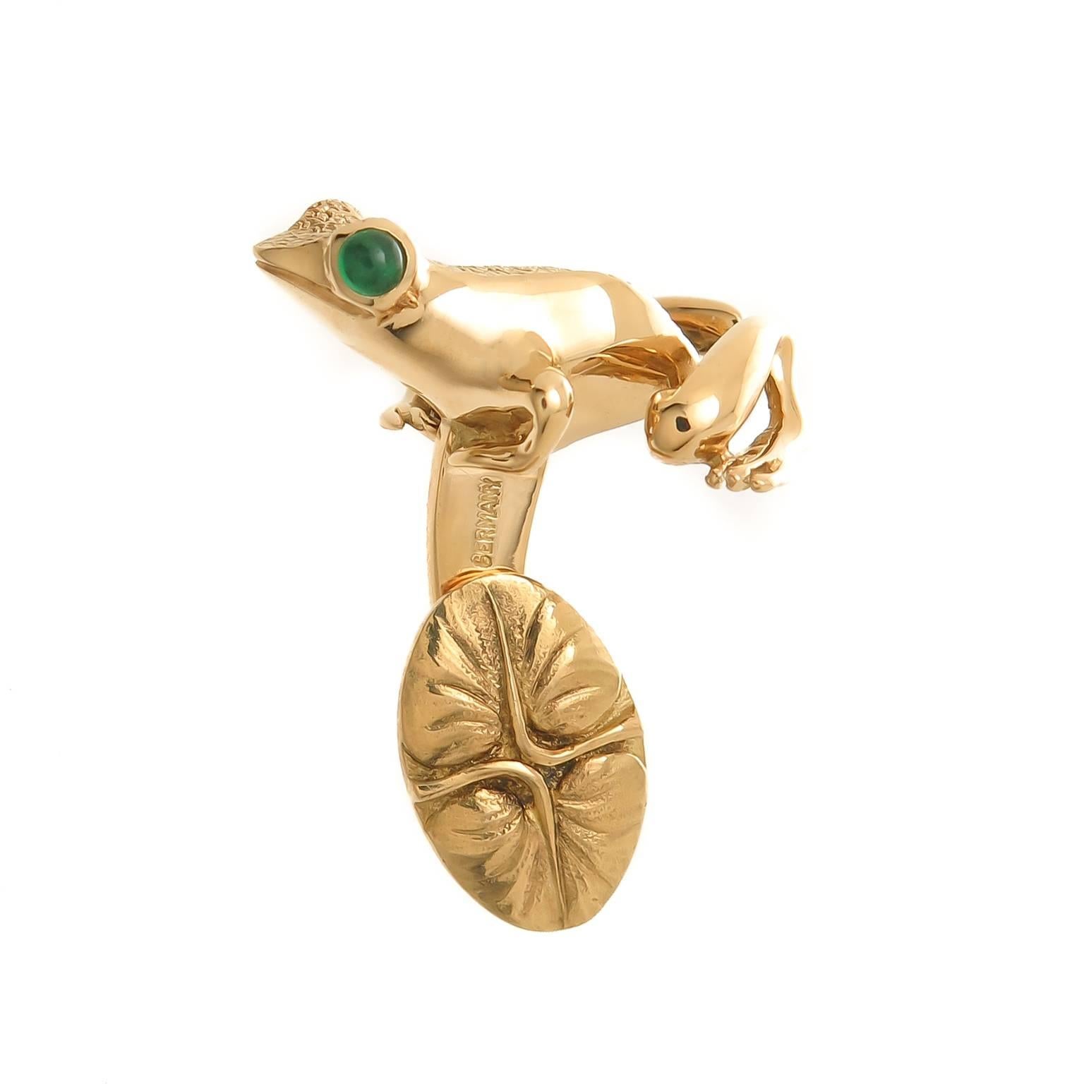 Circa 1990s Tiffany & Company 18K yellow Gold Frog Cuff-links, measuring 1 inch in length and 3/4 inch wide. Set with Cabochon Emerald eyes, nicely detailed with a light texturing. Excellent, unworn condition and in original Tiffany Presentation box.