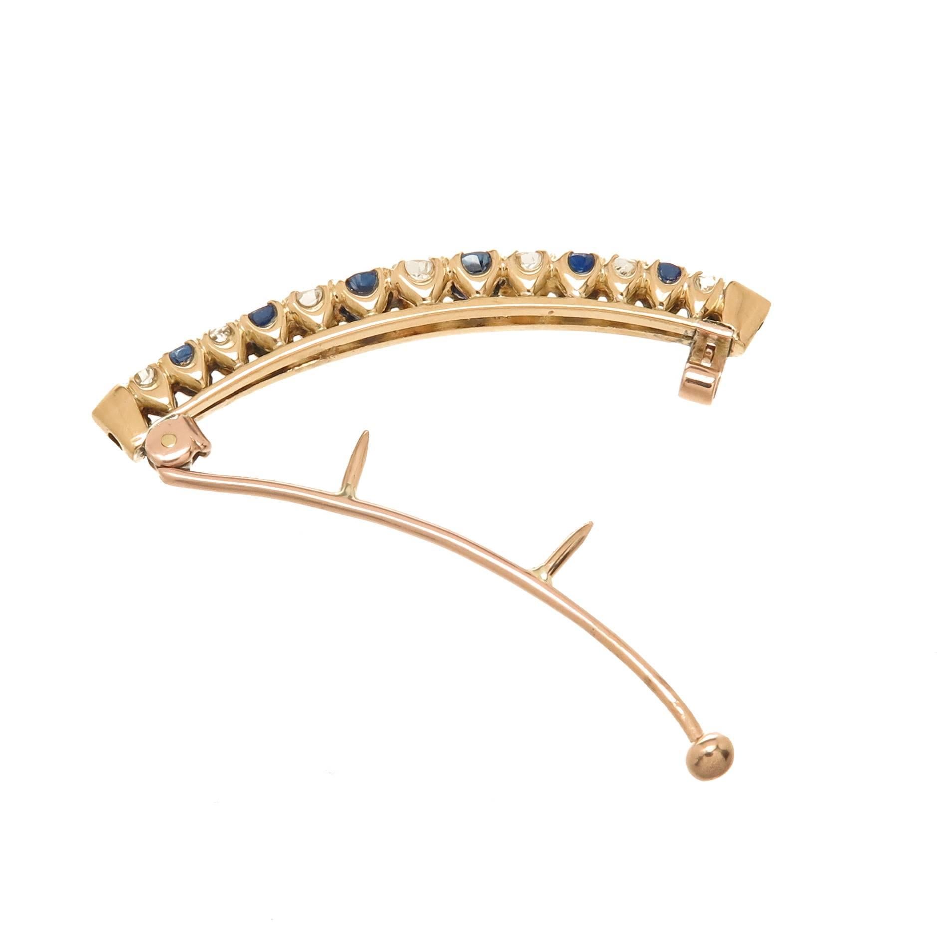 Circa 1900 14K Yellow Gold Hair Barrette, set with Old Mine Cut Diamonds that are very white in color and total .65 Carat, further set with very fine color old cut Sapphires. Total Length 1 3/4 inch in length and 3/16 inch wide.