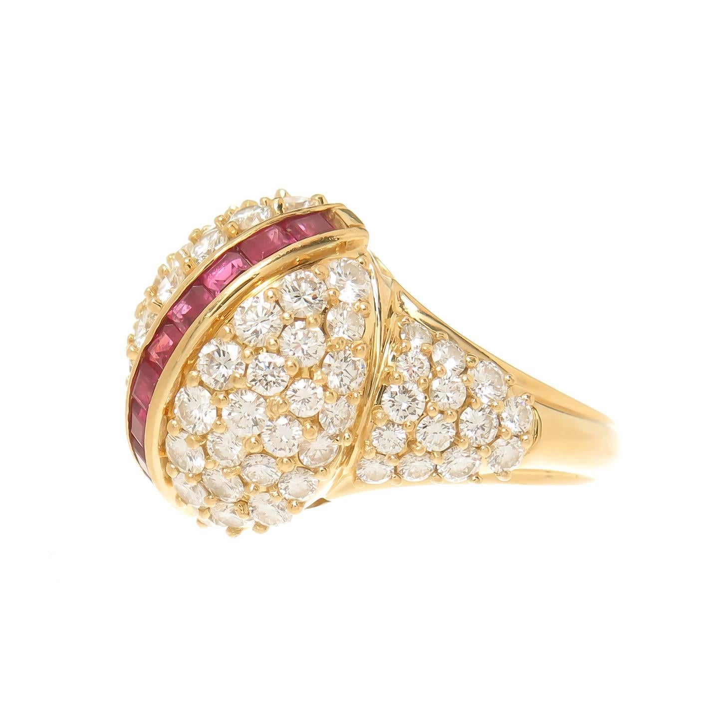 Circa 2000 Hammerman brothers Dome Ring, 18K yellow Gold and set with 3 Carats of Round Brilliant cut Diamonds  that total 3 carats and grade as F-G in Color and VS in Clarity. Further set with Square Cut Rubies of very fine Color. The ring top