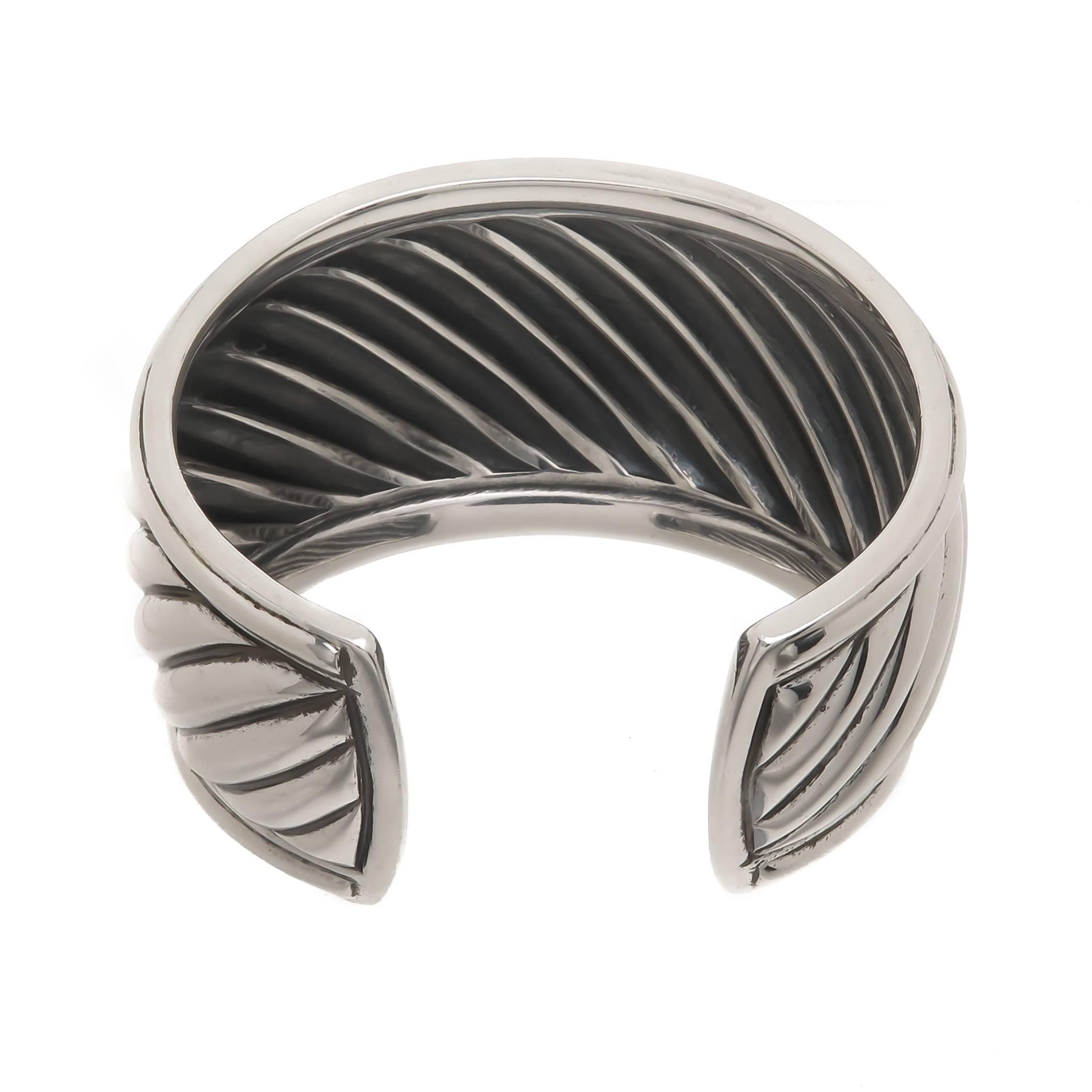 Circa 2010 David Yurman Sterling Silver Thoroughbred Cuff Bracelet, measuring 1 5/8 inch wide with the wrist opening measuring 1 inch wide. Set with 50 round Brilliant cut diamonds on either side of the cuff totaling .75 Carat. Comes in original