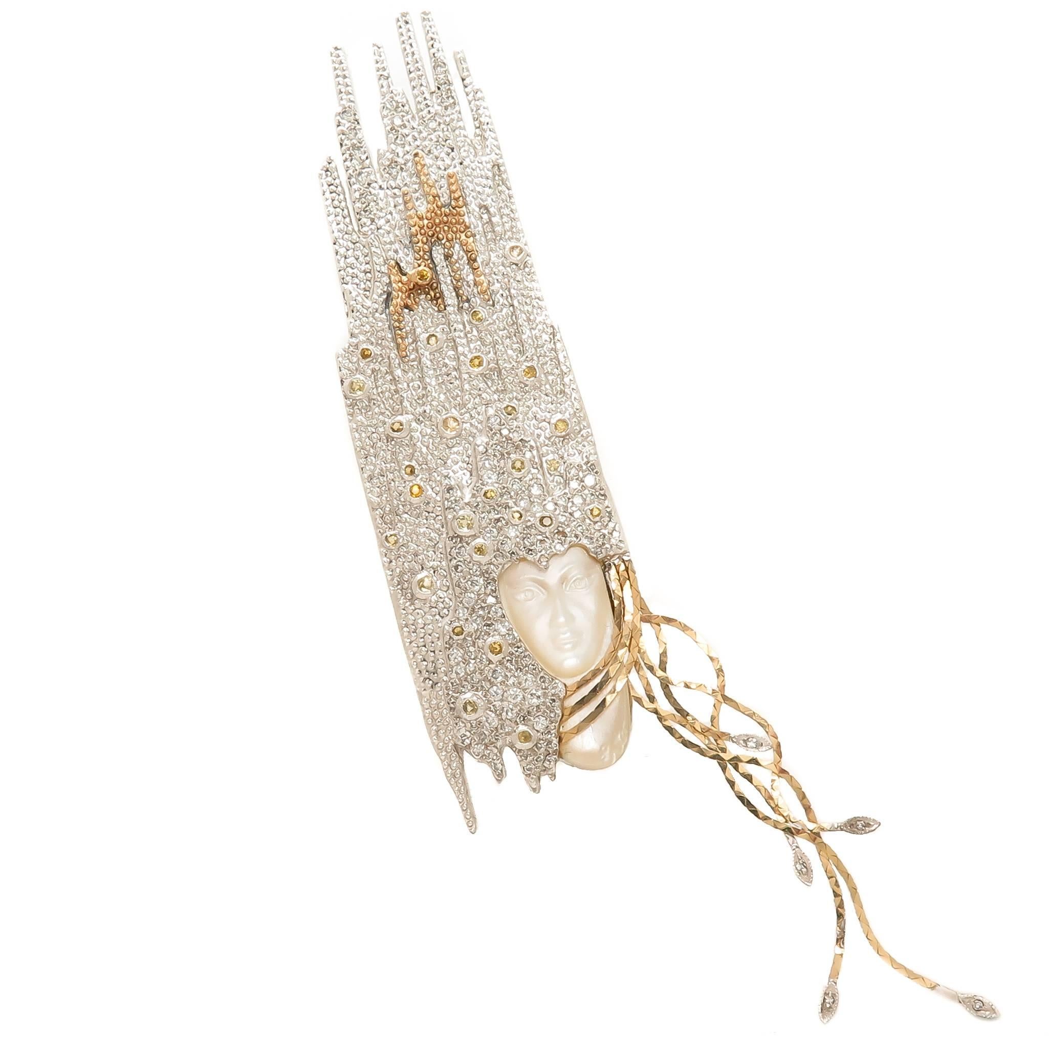 circa 1984 Sophistication Necklace by Erte, 14K Yellow Gold and Sterling Silver, Finely textured and having Granulation work throughout, set with Numerous Diamonds and a Carved Face of Mother Of Pearl. This Piece converts into a large Brooch and a