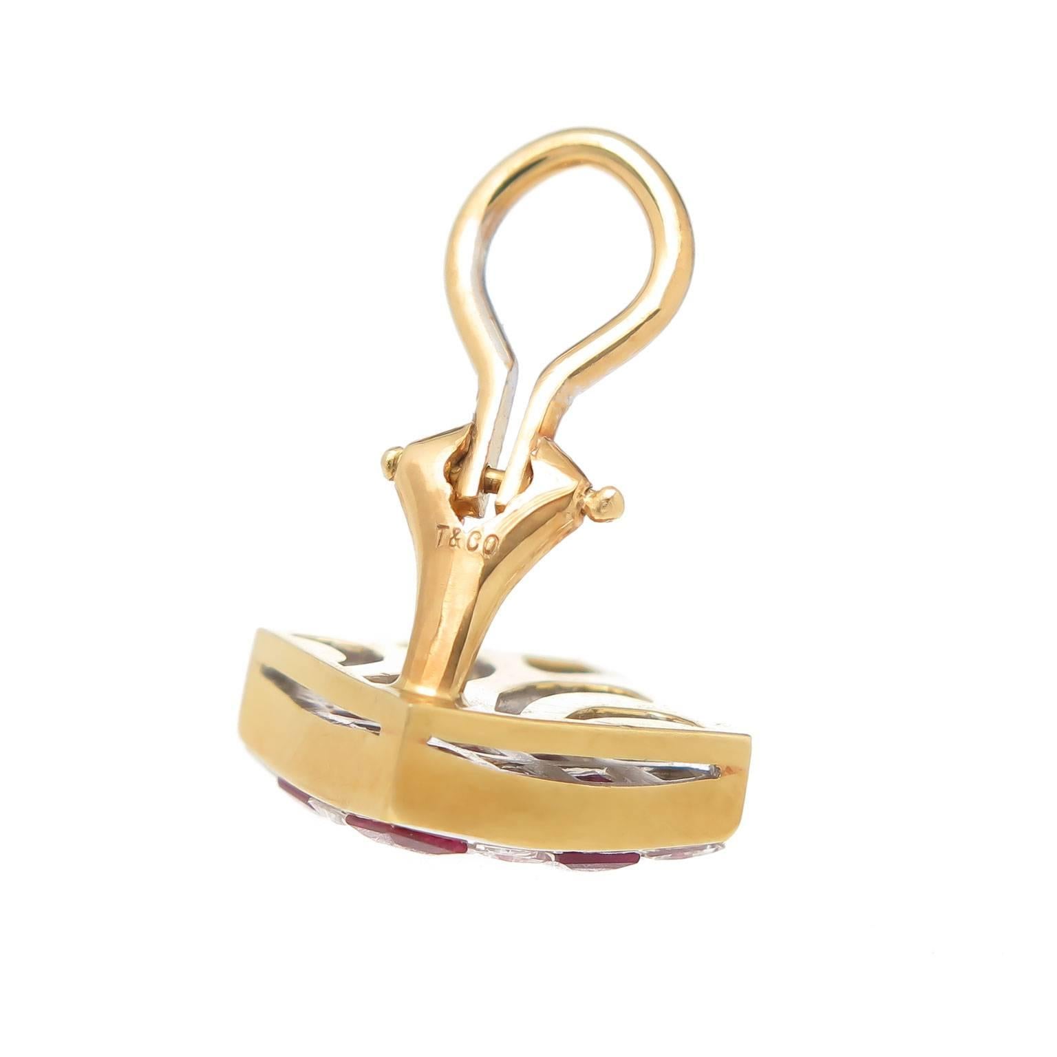 Circa 2000 Tiffany & Co. 18K Yellow Gold Checkerboard earrings, measuring 7/16 X 7/16 inch, set with Princess cut Diamonds totaling 1.30 Carat and Grading as G in color and VVS in Clarity, further set with very fine quality, intense color Rubies.