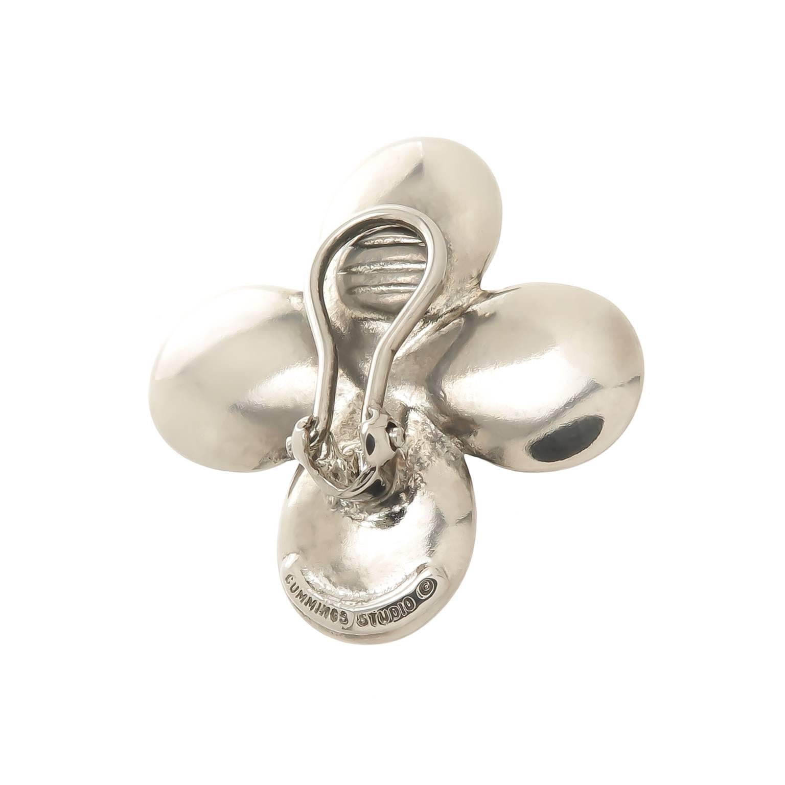 Circa 1980 Angela Cummings studios Sterling Silver Flower form Earrings, measuring 1 1/4 inch in diameter. Having an Omega Clip back back to which a post can be easily added if desired. 