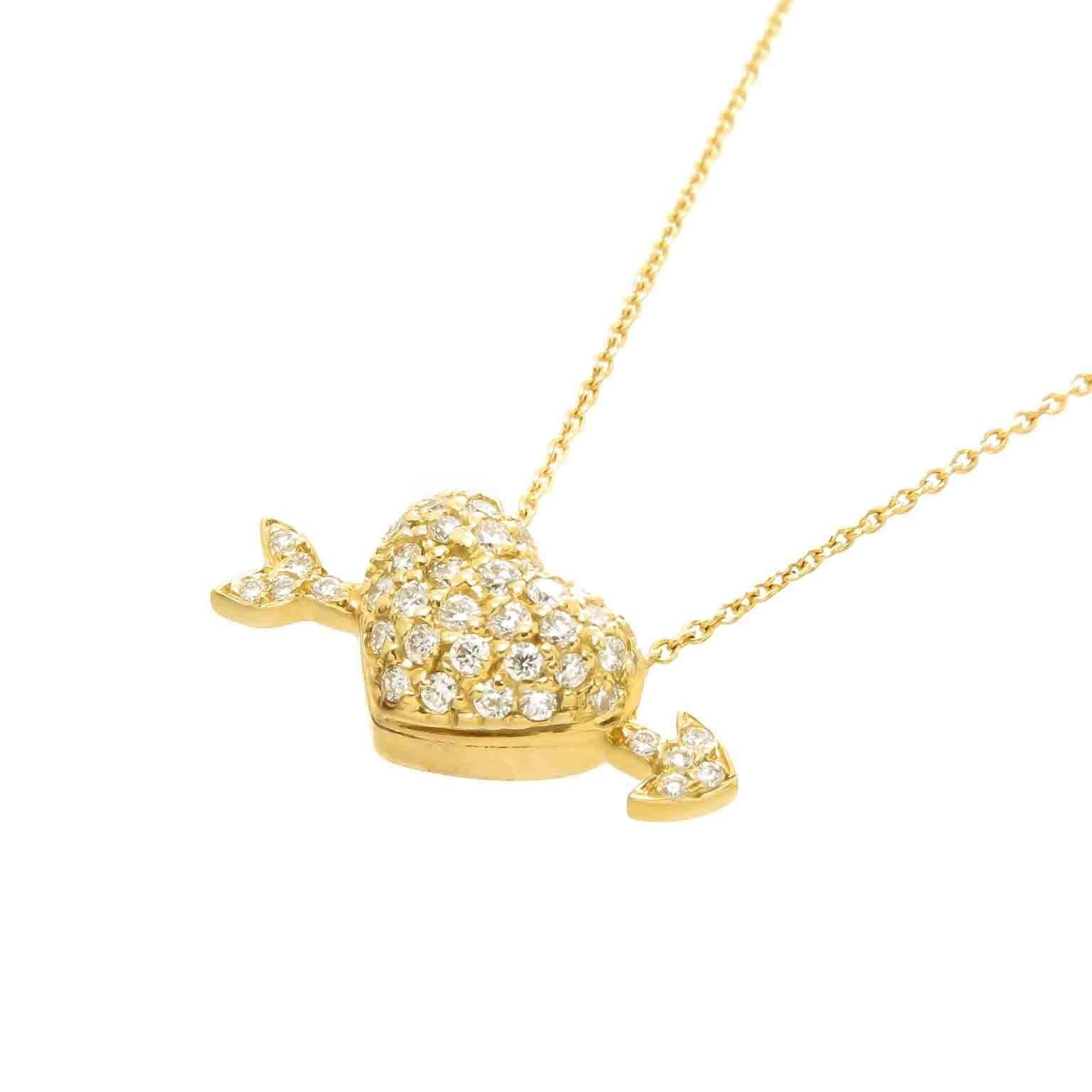 Circa 2012 Roberto Coin 18K yellow Gold Arrow through Heart Pendant, measuring 7/8 inch in length, pave set with Round Brilliant cut Diamonds totaling 1/2 carat. Suspended from a 16 Inch Chain. The last known retail price of this piece new was