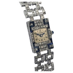 Montre-bracelet pour femme de style Art déco française, signée J. E. Caldwell, en platine, diamants et saphirs