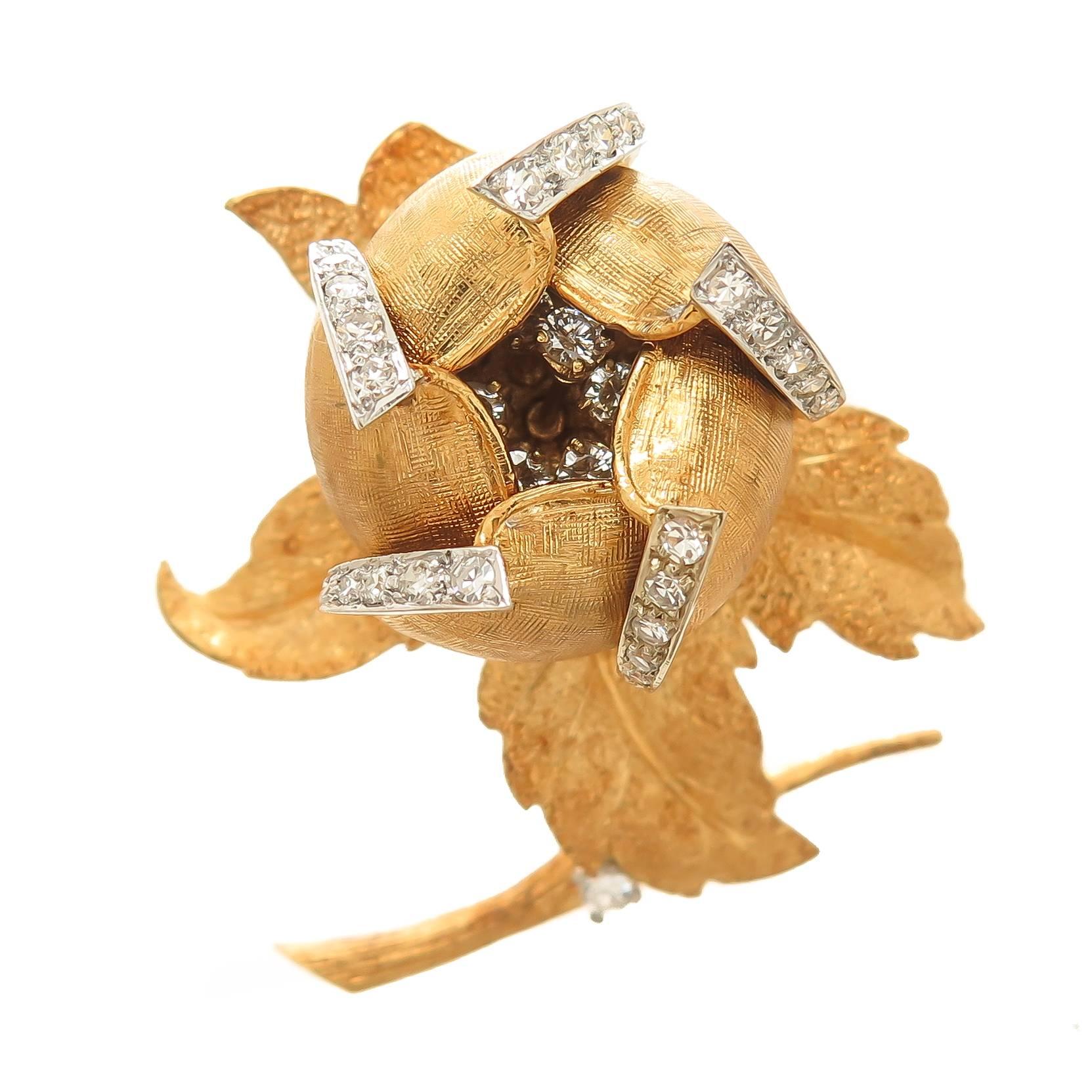 Circa 1970s Hammerman Brothers 18K Yellow Gold Flower Clip Brooch set with Round Brilliant cut Diamonds totaling 1.50 carats and Grading as G in Color and VS in Clarity. Each Petal is articulated so that they open and close. Very well detailed with