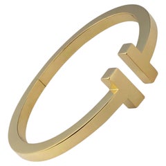 Tiffany & Company „T“ – Großes Armreif-Armband aus Gelbgold