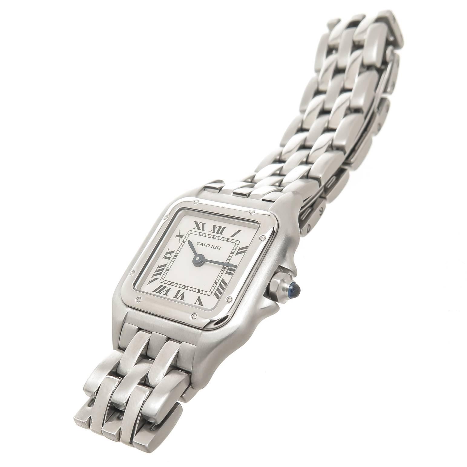 Circa 2000 Cartier Panther Collection Ladies Wrist Watch, 30 X 22 MM Stainless Steel Water resistant Case, Quartz Movement, Silvered Dial with Black Roman Numerals. 1/2 inch wide Steel Panther Bracelet with Deployment buckle. Total Length 6 inches.