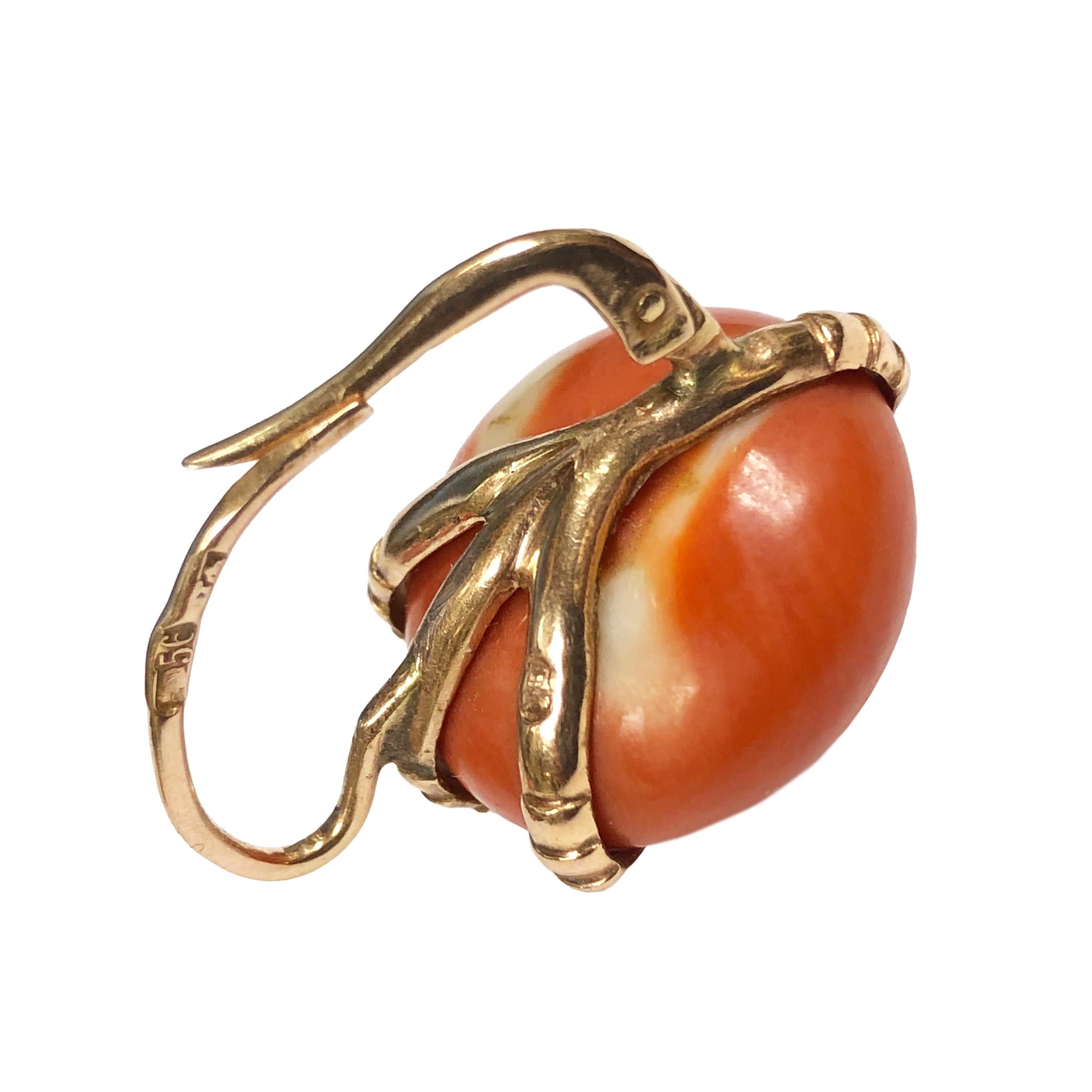 Circa 1910 14K Yellow Gold Russian Earrings with Claw form prongs holding a very fine Orange Red color round button Coral each measuring 20 MM in diameter. Having several City, Maker and Gold standard stamps throughout the Earrings. 