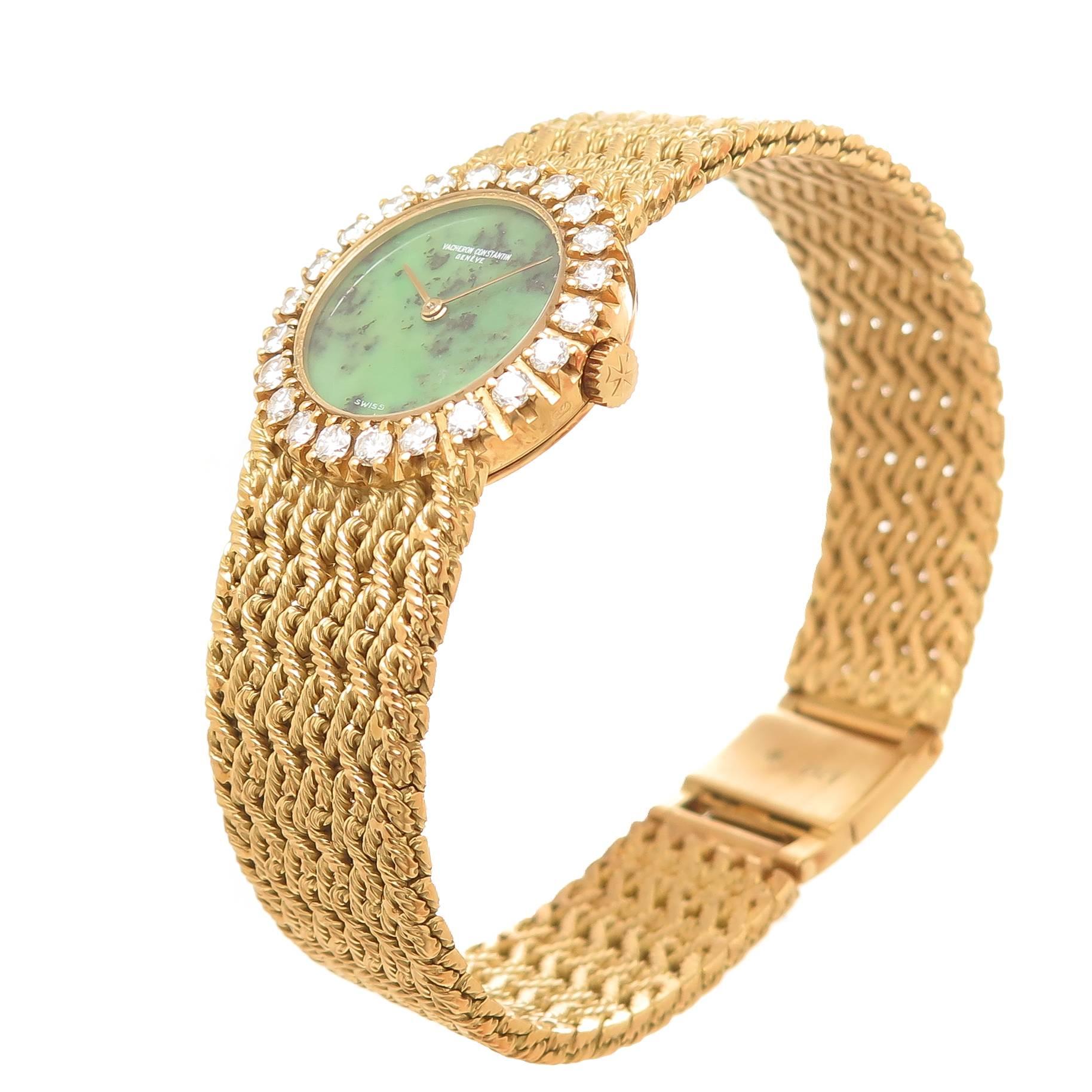 Circa 1980s Vacheron and Constantin Ladies 18K yellow Gold Wristwatch. Measuring 22 MM with a Factory Diamond Bezel of Fine White Color Round Brilliant cuts totaling 1 carat. 17 Jewel Manual wind, Mechanical movement, Jadeite Stone Dial.  5/8 inch