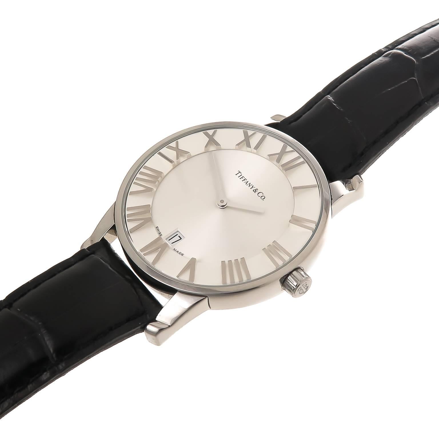 Circa 2010 Tiffany & Company Atlas Collection Wrist Watch, 37MM Stainless Steel Case, Quartz Movement, scratch resistant crystal, engine turned sunk center dial with Calendar window and outer dial ring with raised Roman numerals.  Black Calfskin