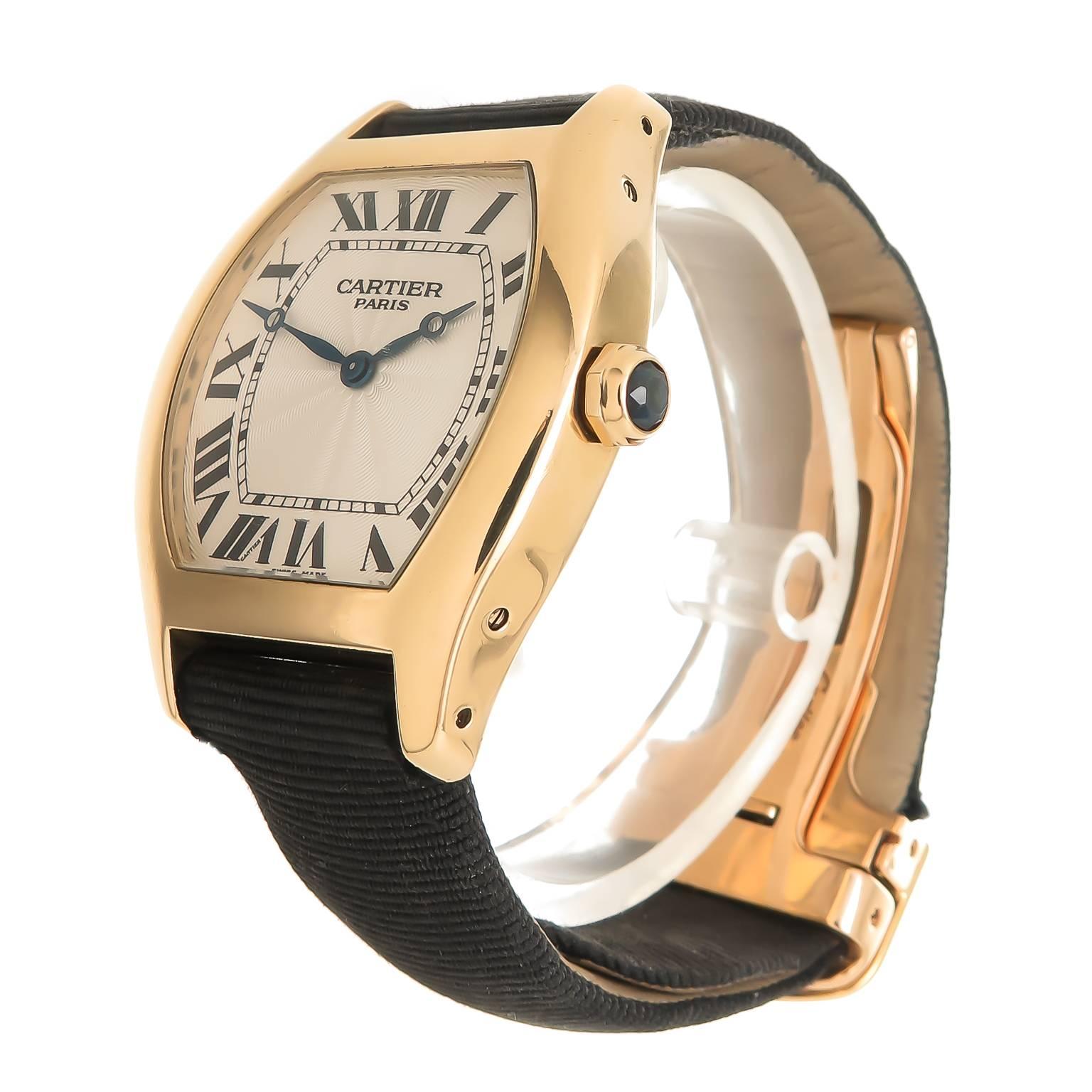 Circa 2012 Cartier Large Tortue Reference 2496C Wrist Watch, 18K Yellow Gold Water Resistant case measuring 44.9 MM X 36 MM X 9.4 MM thick. Caliber 430 Manual wind movement, Engine turned Silvered dial with Black Roman Numerals, scratch resistant