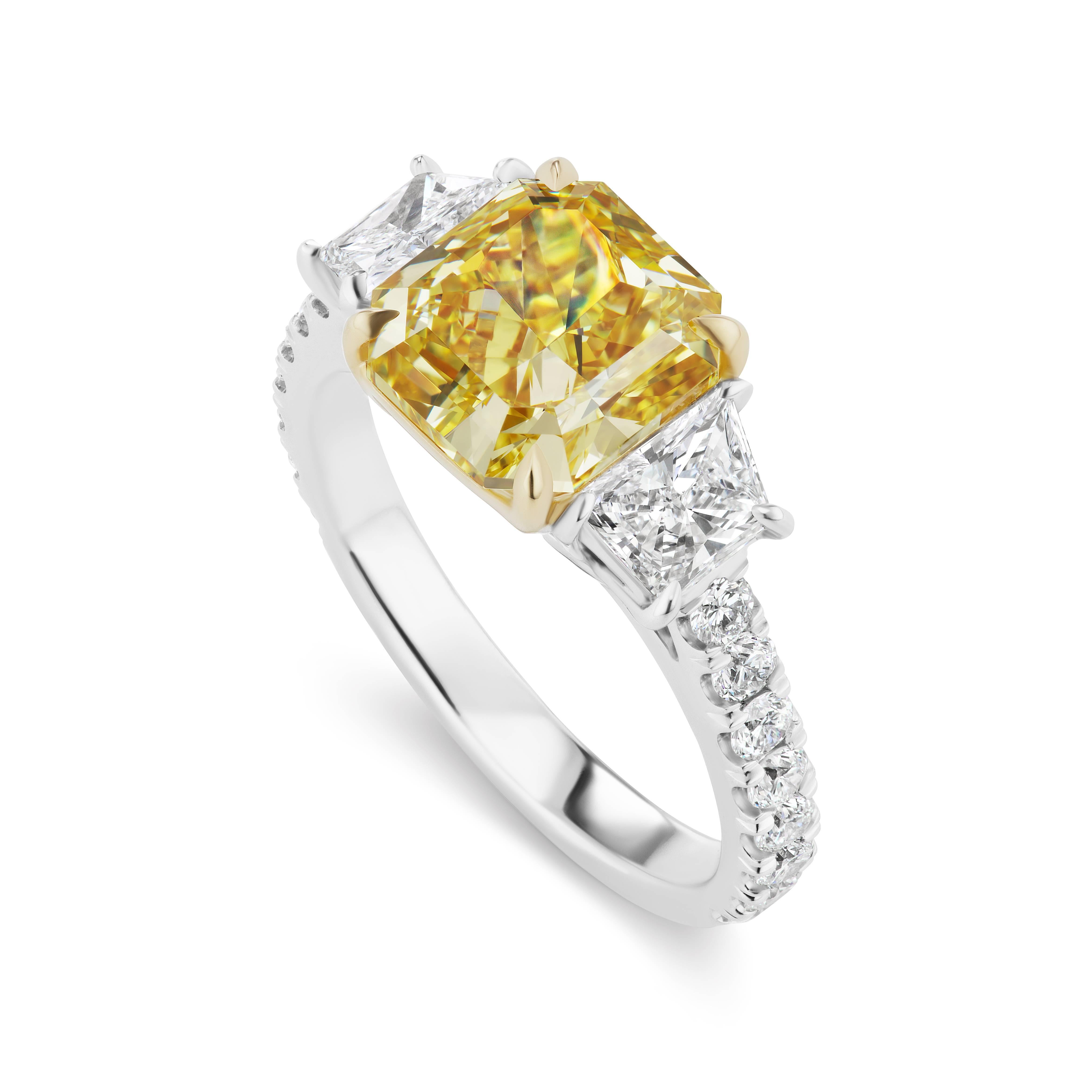 From the collection of Scarselli, this  exceptional 3.05 carat Radiant Cut Natural Fancy vivid Yellow diamond is  VS2 clarity.  From the Scarselli Classics grouping, this diamond may be ordered with a custom mounting and is mounted here with .73