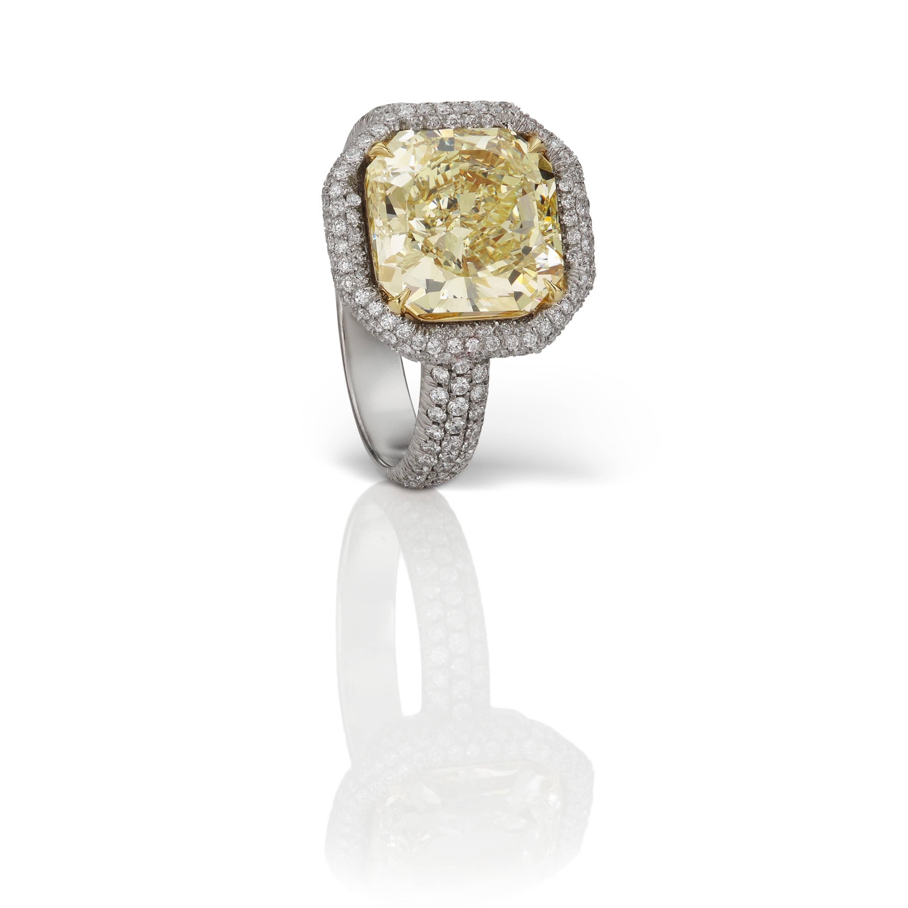 From Scarselli, this GIA certified 4.46 carat Fancy Yellow Radiant Cut Diamond set in a platinum pave mounting with 0.75 total carats of white diamonds (see certificate picture for detailed stone information).  This diamond may be custom designed to