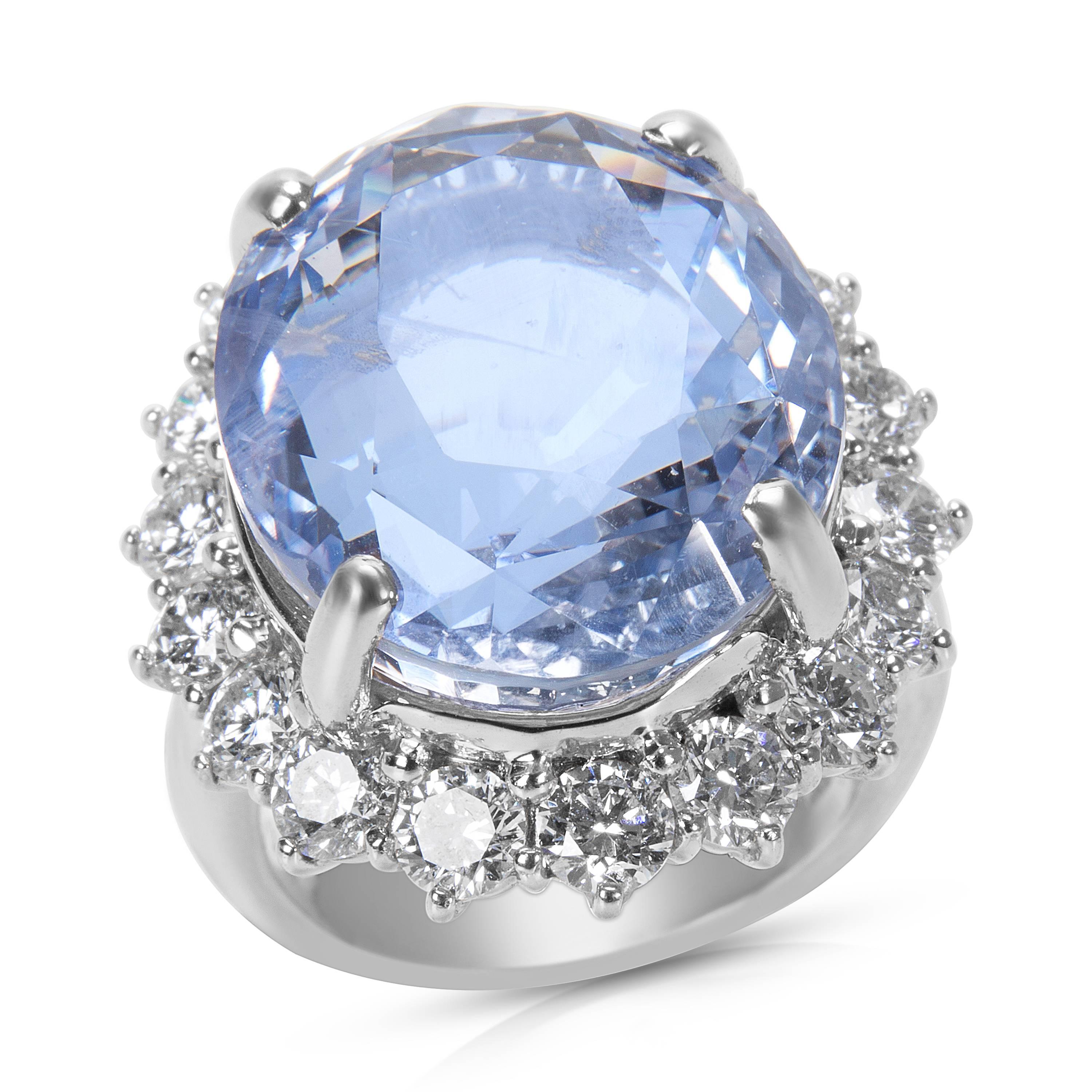 With a stunning 25.60 carat light blue Ceylon, oval shaped sapphire at its center, this ring is not only elegant, but regal. Surrounding the sapphire are 2.60 carats of diamonds. Ring Size is 6.25.

This ring is brand new and unworn. It comes with