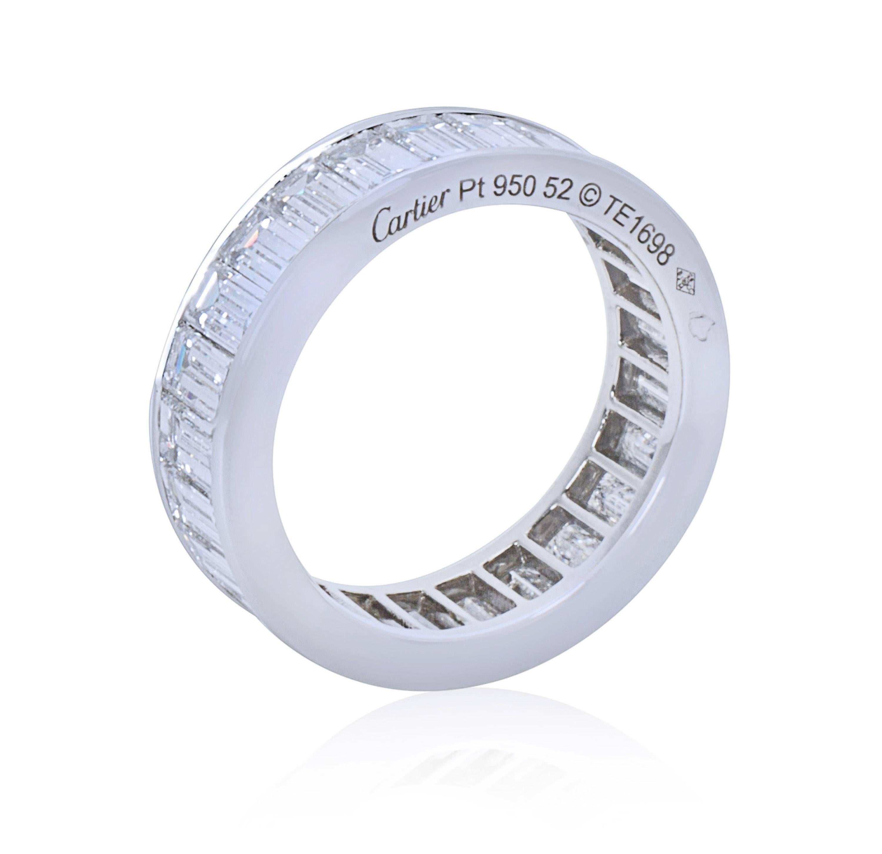 Dare to impress with this stunning and brilliant Cartier platinum eternity ring featuring 24 high-color, translucent baguette cut diamonds with an approximate total weight of 6.00 carats. Measuring 6 mm wide, ring size 6, this unique and dazzling