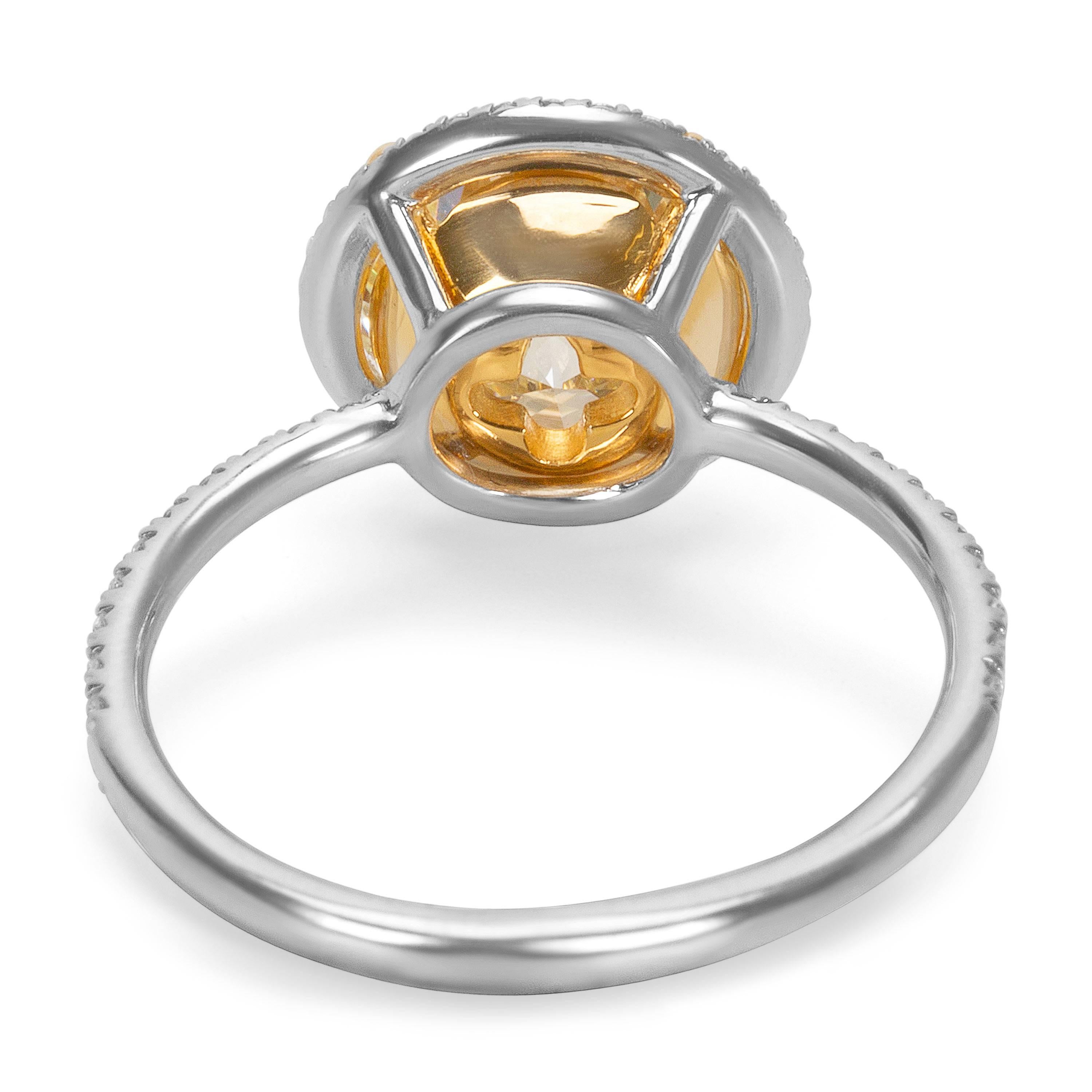 This GIA Certified 3.25 Round Cut Diamond is Q-R in color and VVS1 in clarity. It is set in an 18K yellow gold basket setting. The diamond halo and platinum band features 0.25 carats of round cut diamonds, G-H in color and SI2-I1 in clarity. 

Ring