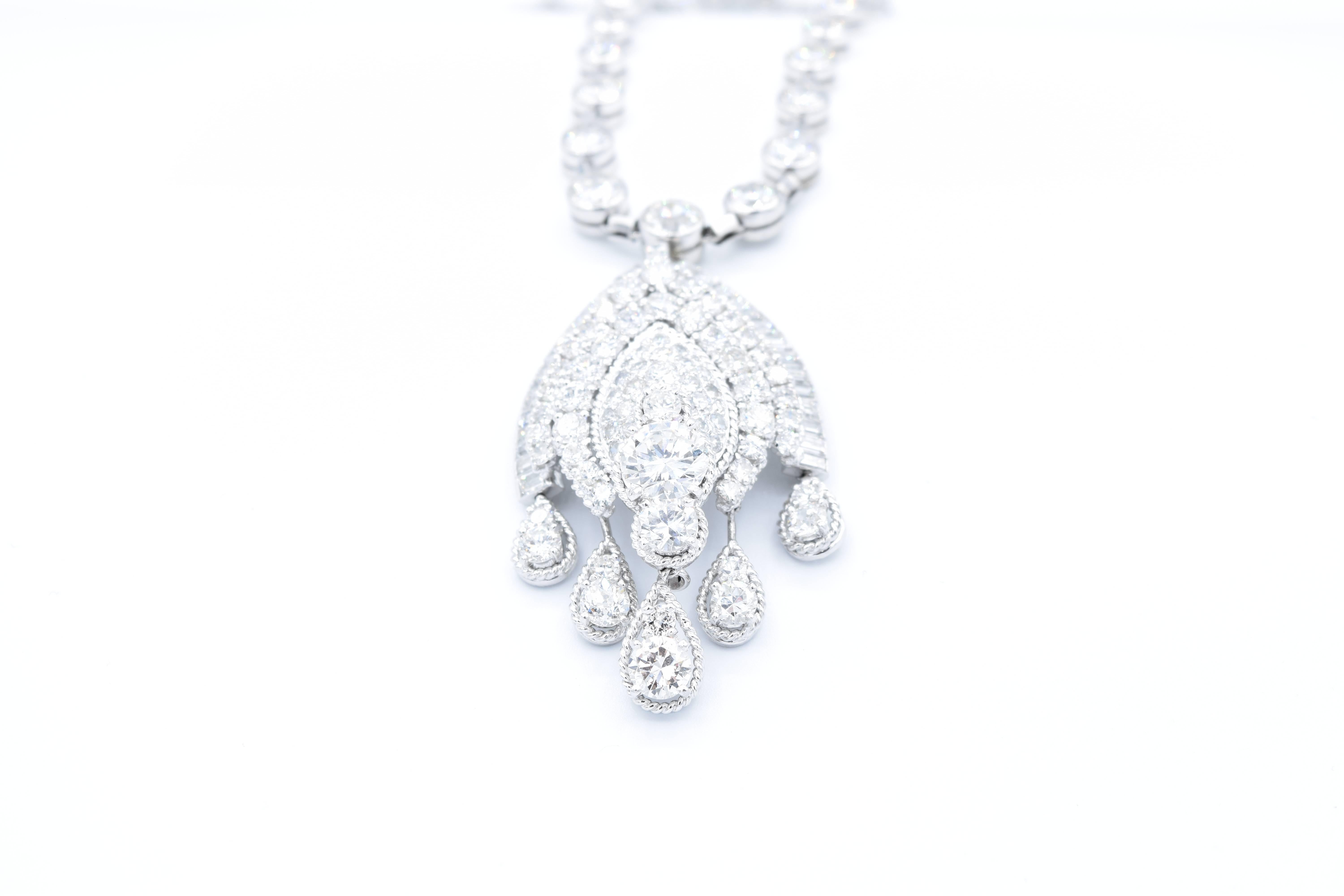 This magnificent Van Cleef & Arpels Necklace can be worn as a one piece or as a necklace and a brooch.
The graduated Necklace is set with 44 round diamonds from 0.20ct to 1.25ct each, with approximately 21 total carats.
This Brooch / Pendant has 29