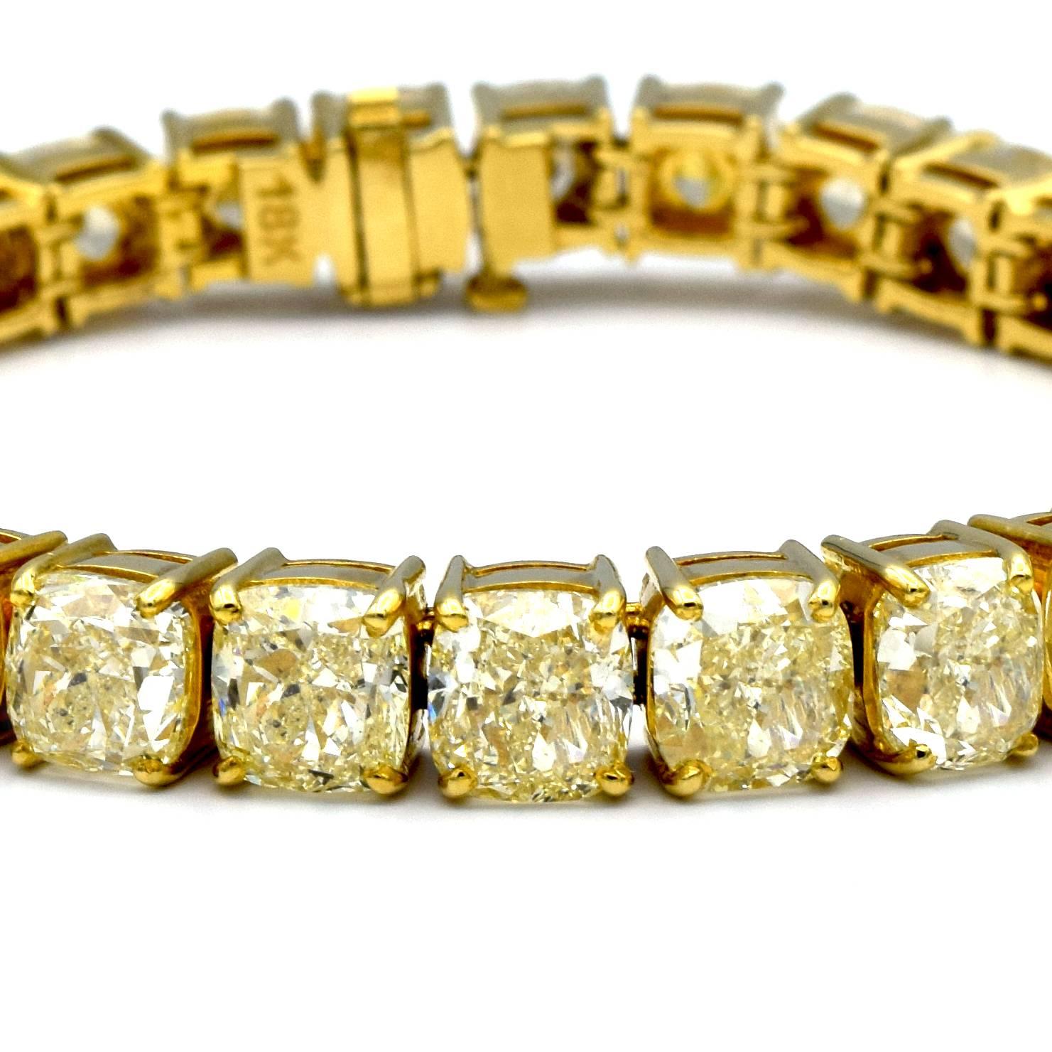 TENNIS BRAC 18KYG 31ST CU 47.13CTW     
This amazing bracelet features 31 natural yellow diamonds totaling 47.13 carats. 
Set in 18K yellow gold, these beautiful, Cushion-cut diamonds, weighing approximately 1.50 carats each, sparkle with