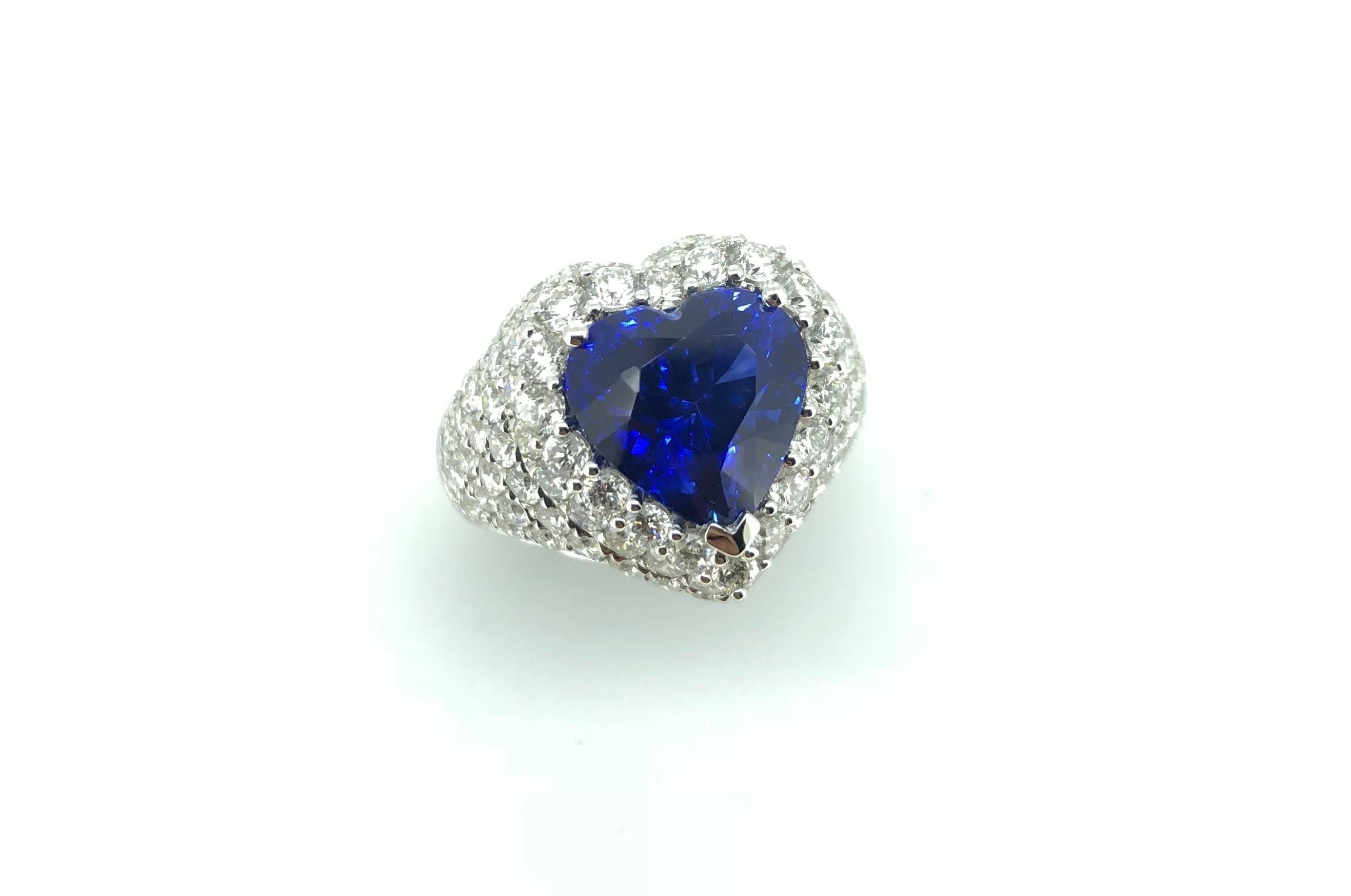 A Royal Blue Heart Shape 6.42 Carats Blue Sapphire Diamond Cocktail Party Dress Ring. Mounted in 18K White Gold and Diamonds. 

Certified By Gem Research Swisslab (GRS). The stunning Royal Blue colour-grade Natural Sapphire is Heated only.  

The